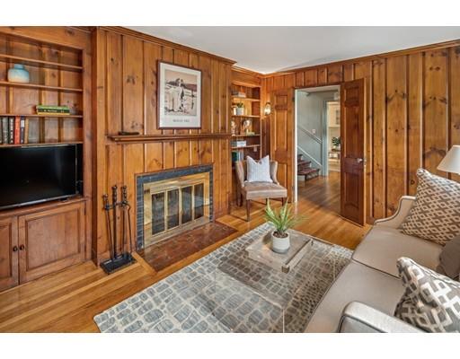 54 Sturtevant Road Quincy, MA 02169 - Photo 8 of 32 a living room with furniture a flat screen tv and a fireplace