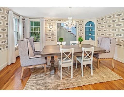 54 Sturtevant Road Quincy, MA 02169 - Photo 10 of 32 a dining room with furniture a chandelier and wooden floor