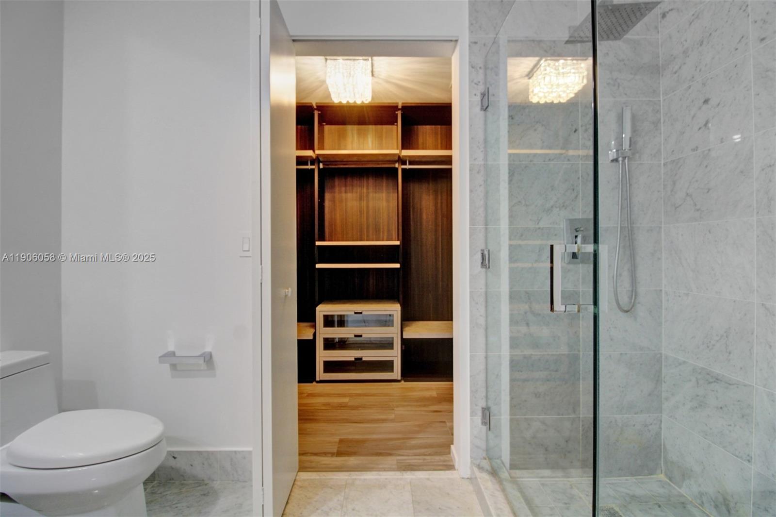 801 South Miami Avenue, Unit 4309 Miami, FL 33131 - Photo 12 of 34 a bathroom with a shower and a toilet