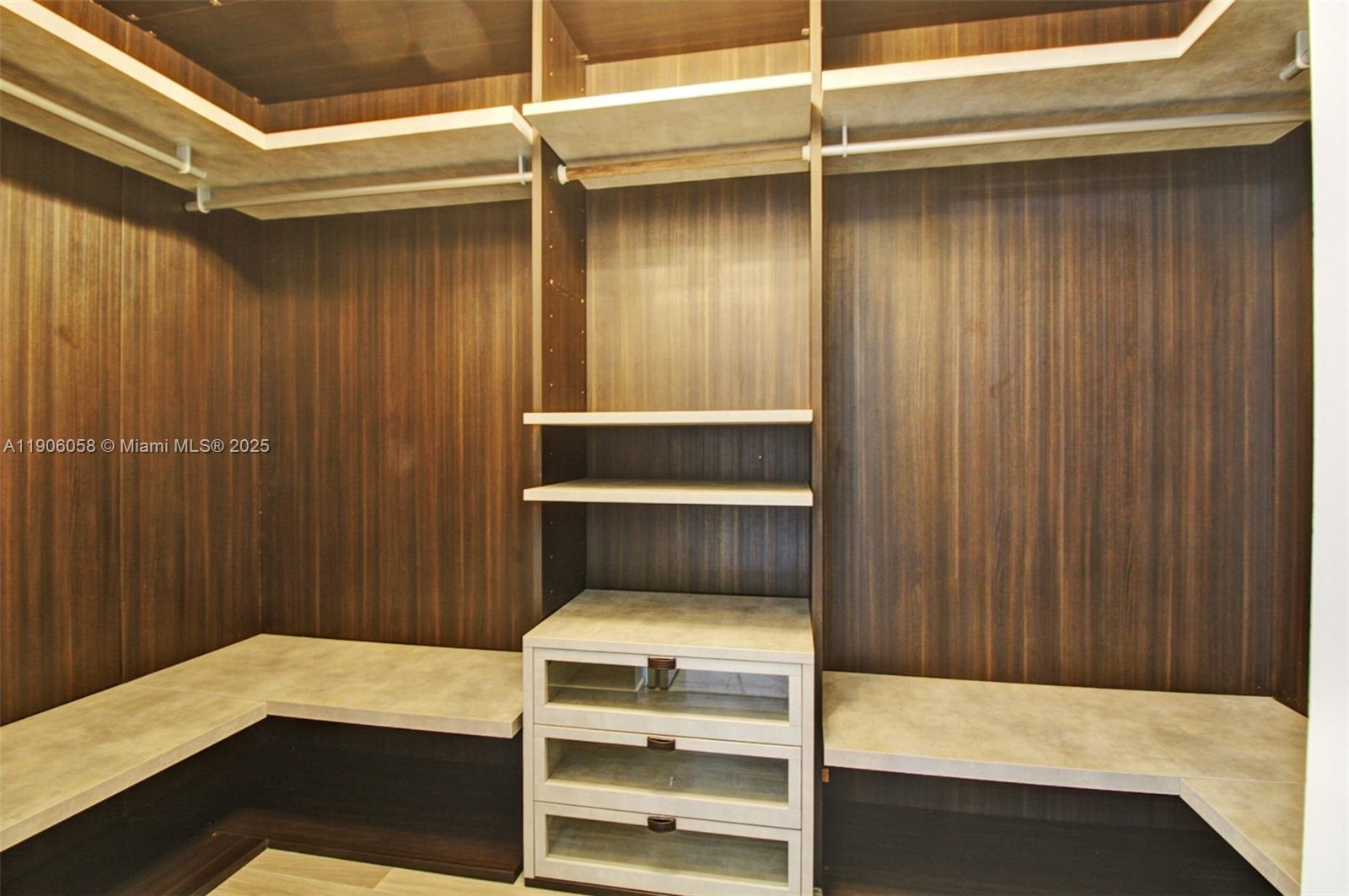 801 South Miami Avenue, Unit 4309 Miami, FL 33131 - Photo 13 of 34 a room with a bed and a cabinet