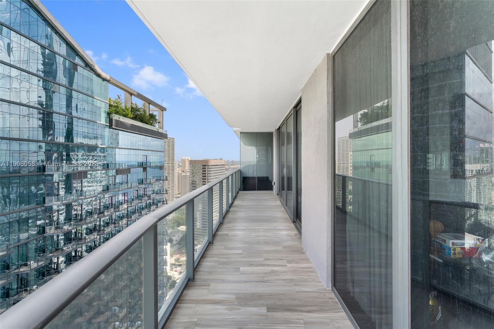 801 South Miami Avenue, Unit 4309 Miami, FL 33131 - Photo 16 of 34 a view of balcony with wooden floor