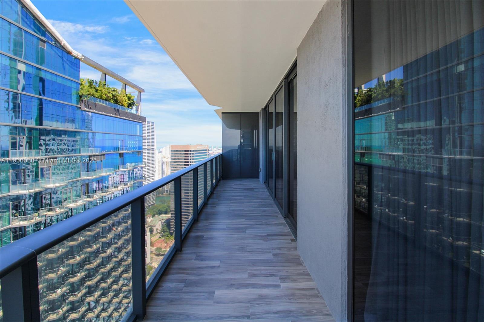 801 South Miami Avenue, Unit 4309 Miami, FL 33131 - Photo 25 of 34 a view of balcony with wooden floor and potted plants