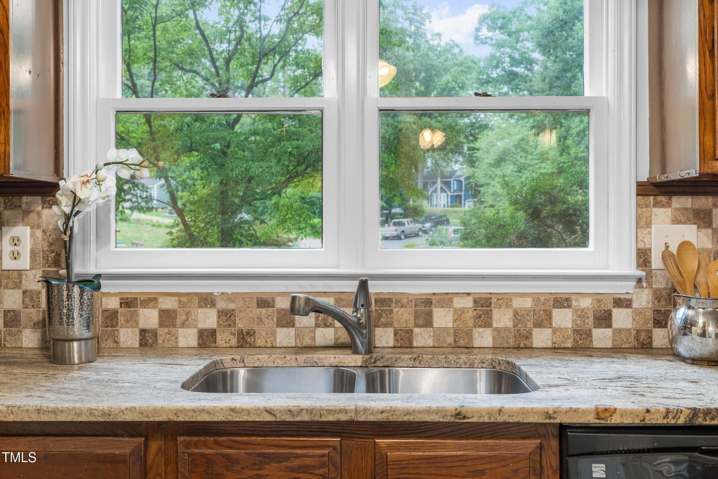 105 Firewood Circle Raleigh, NC 27607 - Photo 15 of 50 a view of a sink and a granite counter top