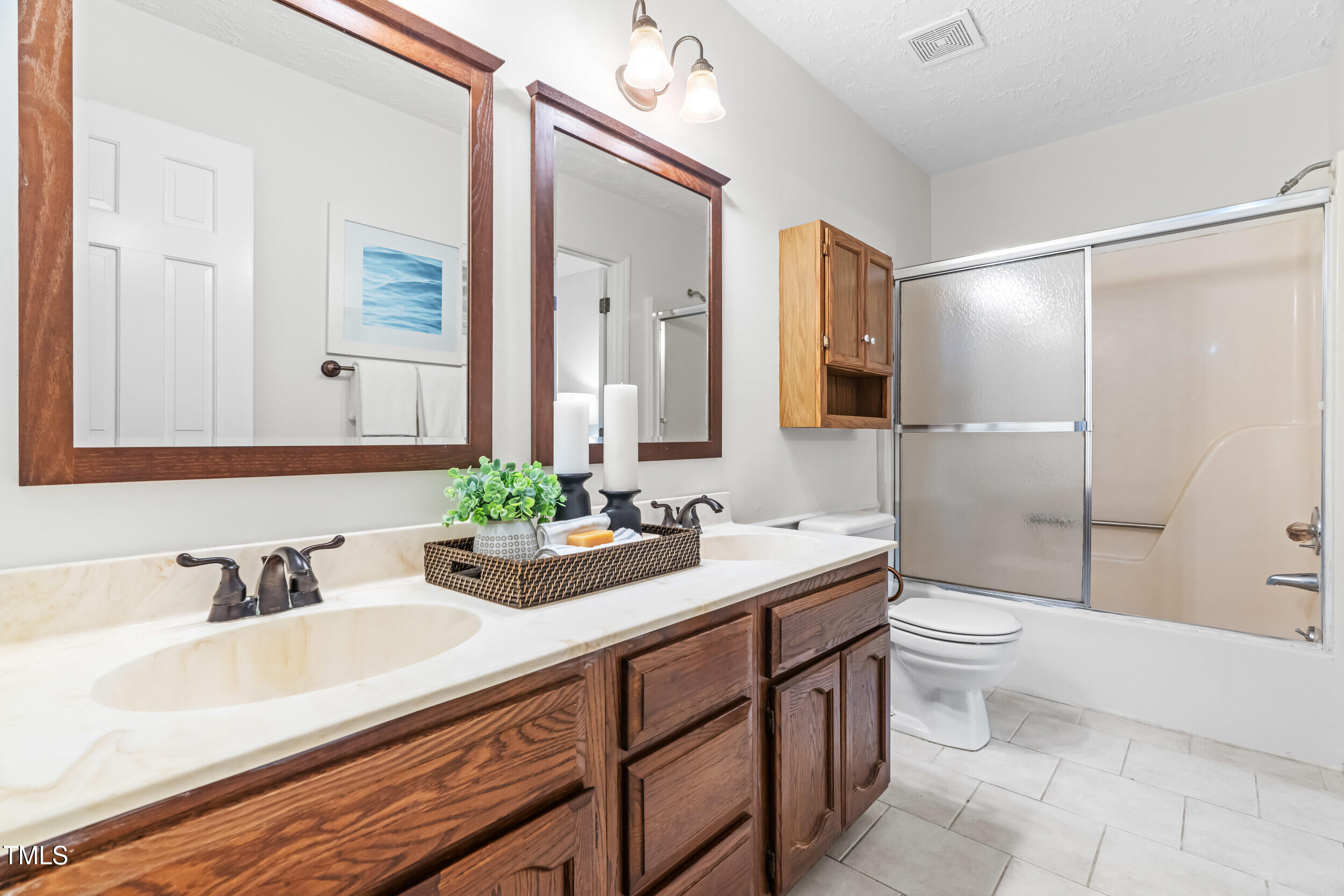 105 Firewood Circle Raleigh, NC 27607 - Photo 25 of 50 a bathroom with a sink and a mirror