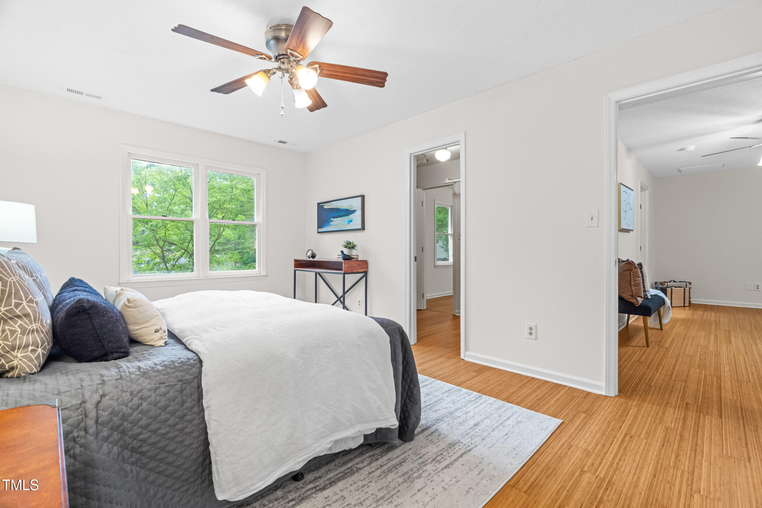 105 Firewood Circle Raleigh, NC 27607 - Photo 27 of 50 a bedroom with a bed and wooden floor
