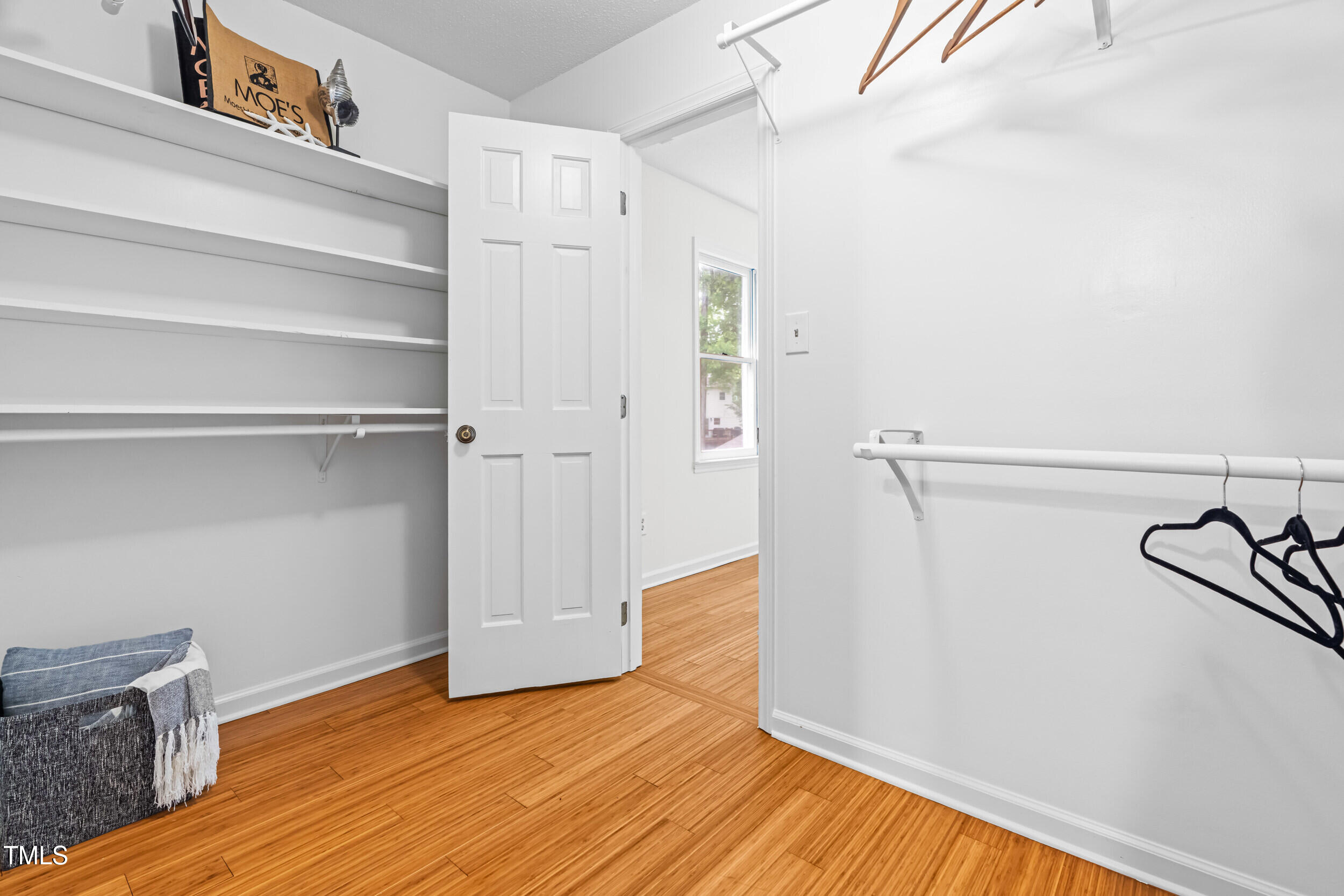105 Firewood Circle Raleigh, NC 27607 - Photo 28 of 50 a view of walk in closet with empty racks