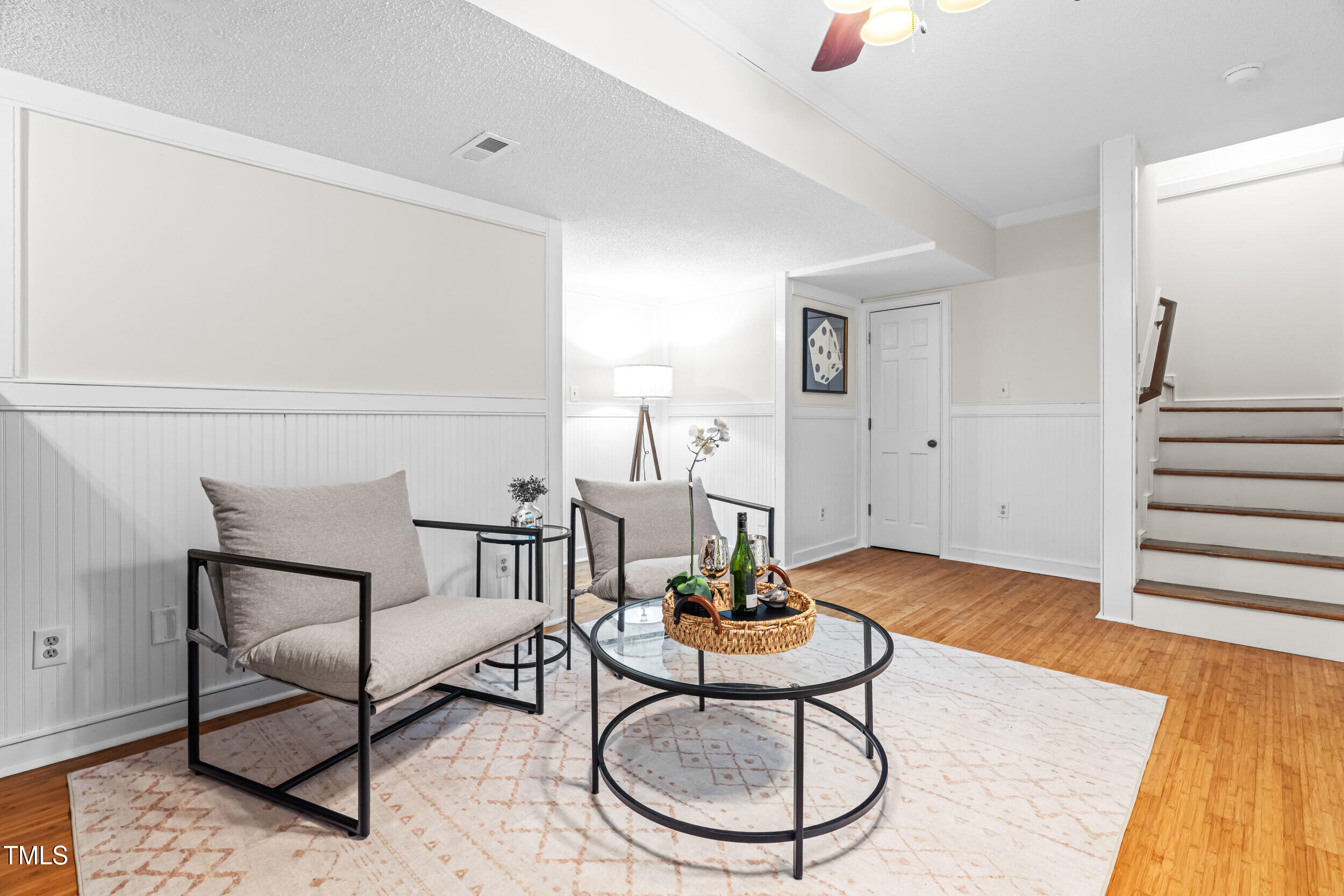 105 Firewood Circle Raleigh, NC 27607 - Photo 35 of 50 a living room with furniture and wooden floor