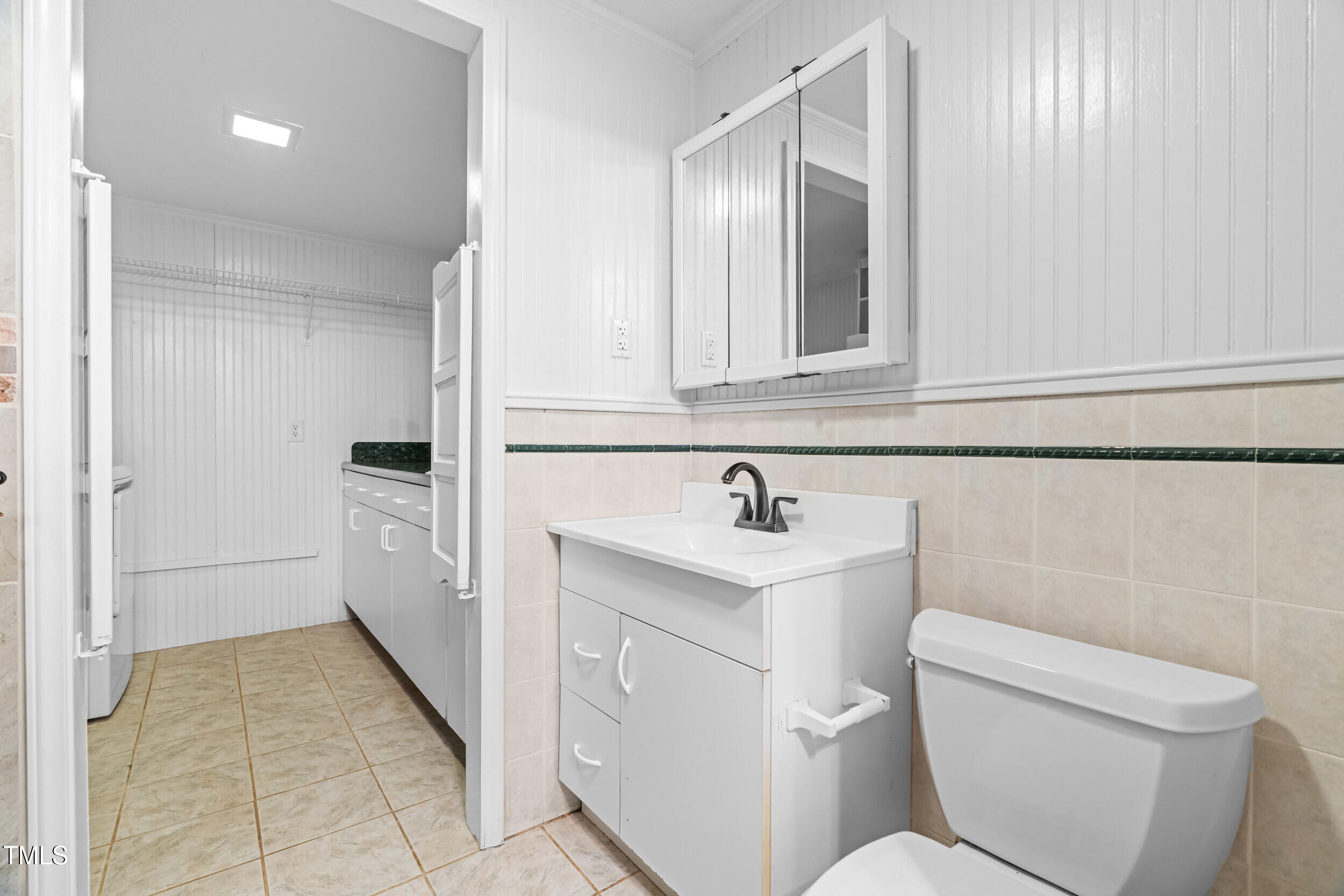 105 Firewood Circle Raleigh, NC 27607 - Photo 36 of 50 a bathroom with a toilet sink and mirror