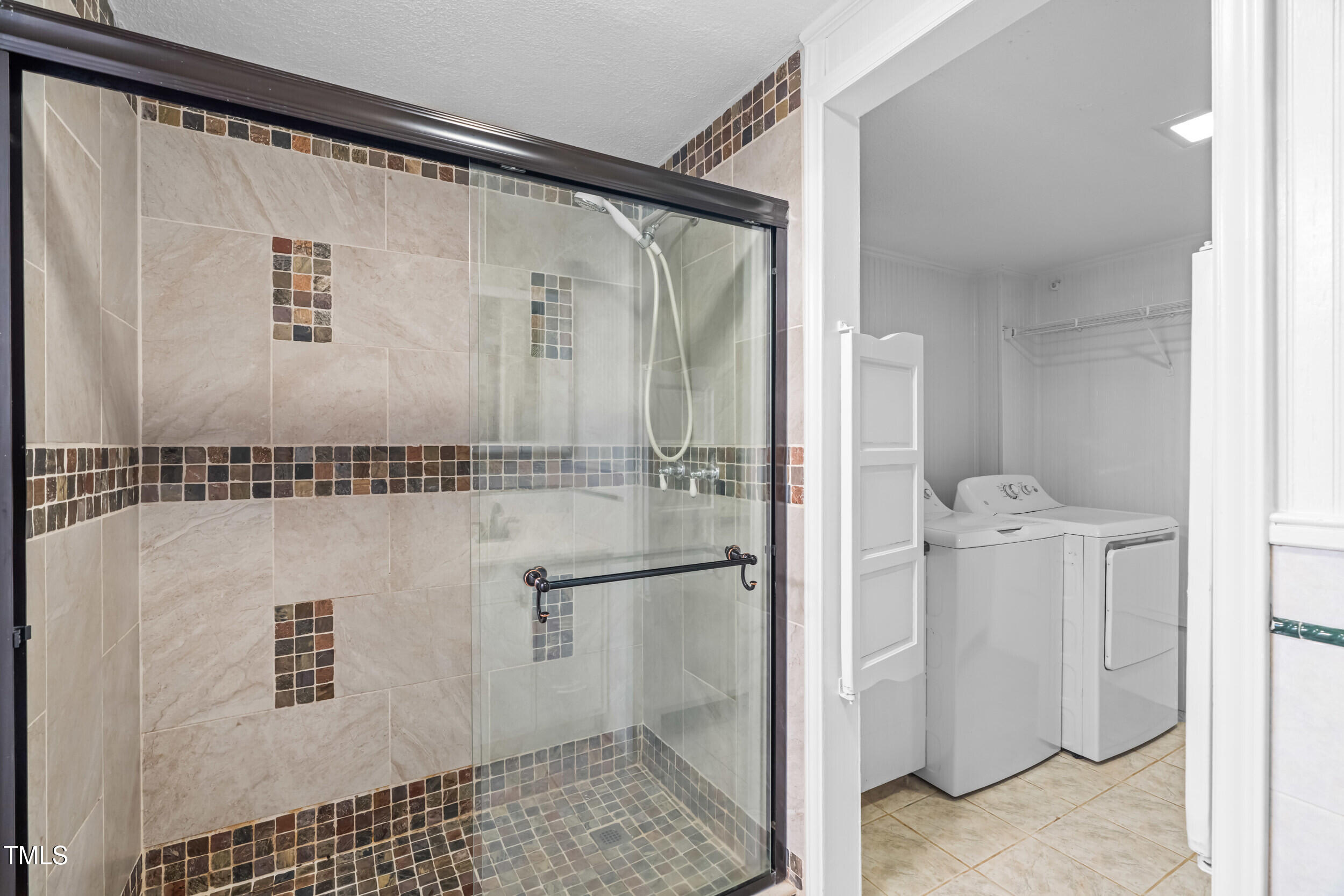 105 Firewood Circle Raleigh, NC 27607 - Photo 37 of 50 a bathroom with a shower and a sink
