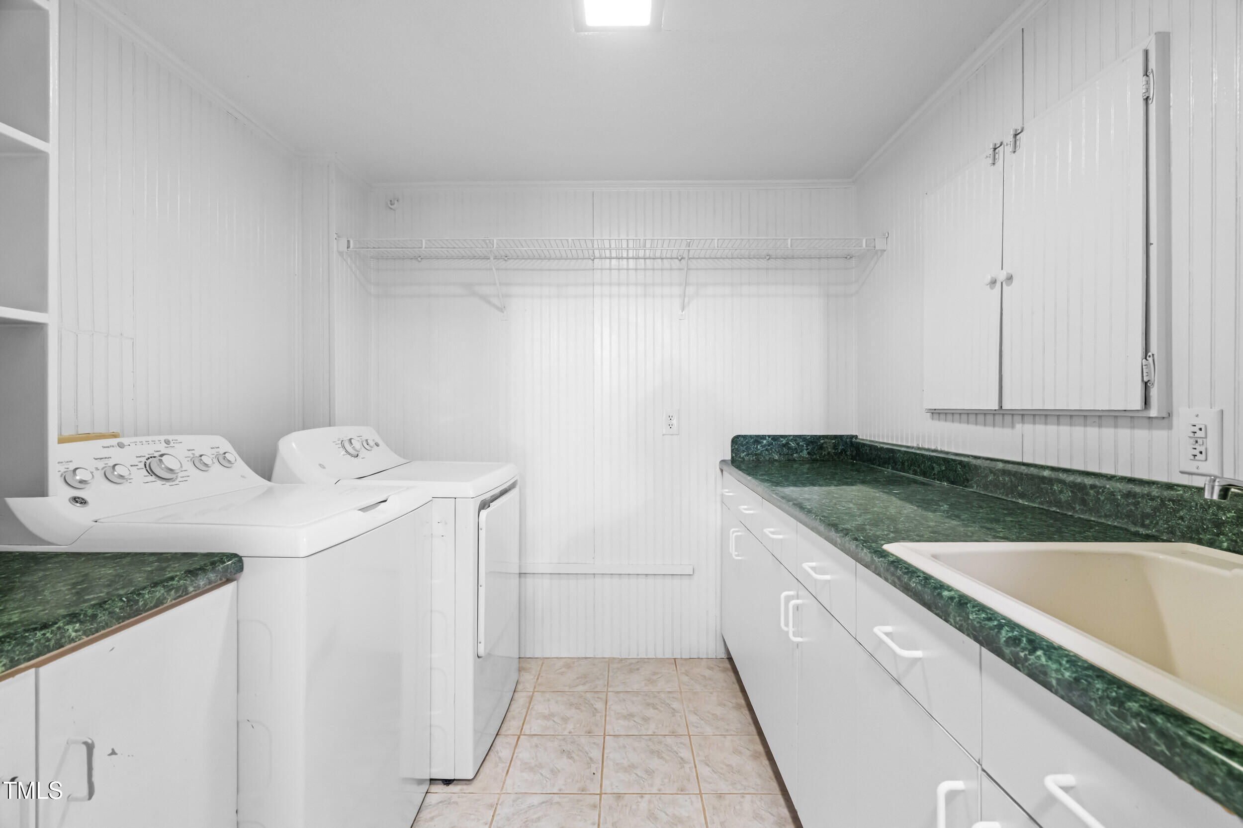 105 Firewood Circle Raleigh, NC 27607 - Photo 38 of 50 a utility room with sink dryer and washer