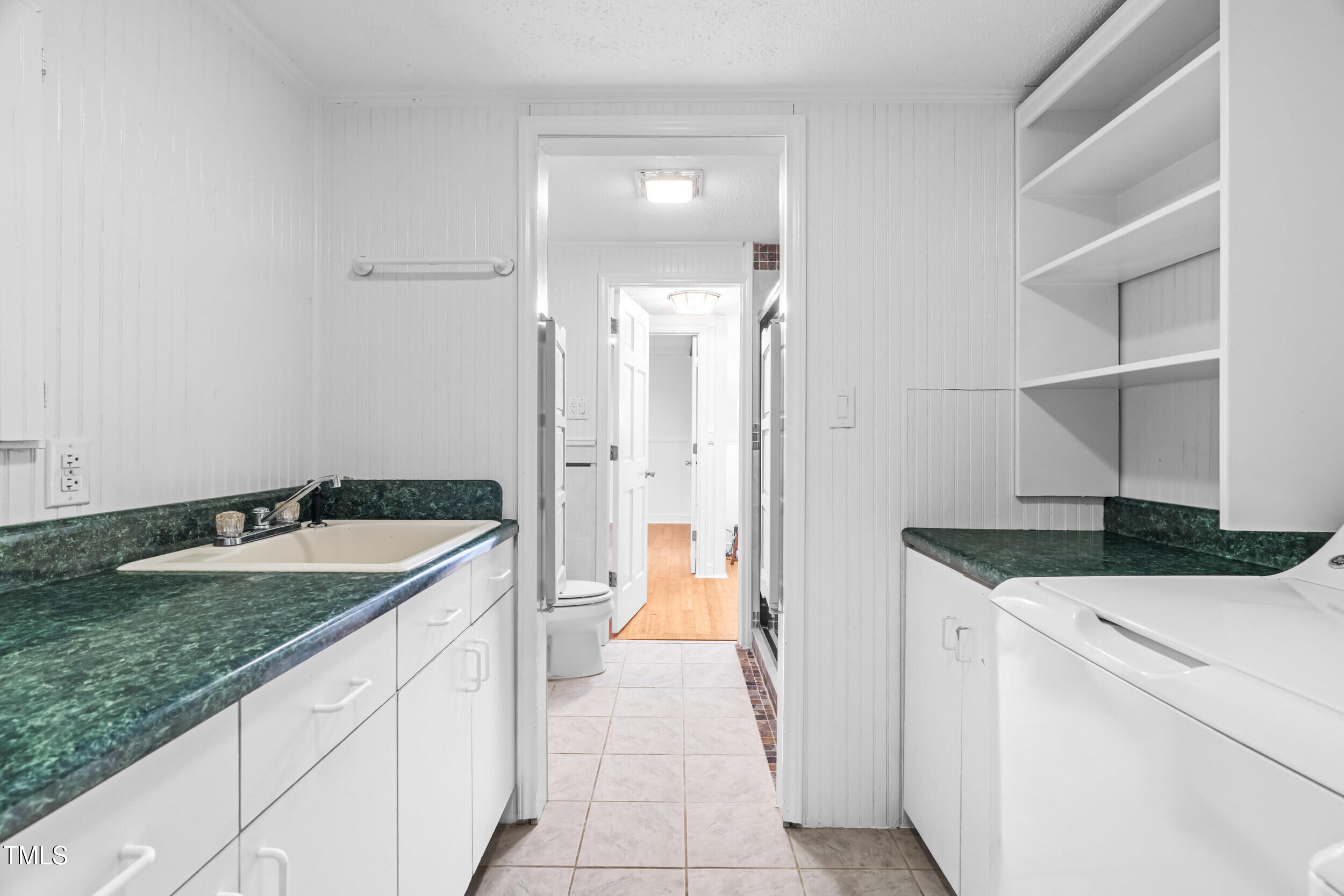 105 Firewood Circle Raleigh, NC 27607 - Photo 39 of 50 a bathroom with a granite countertop sink and a bathtub