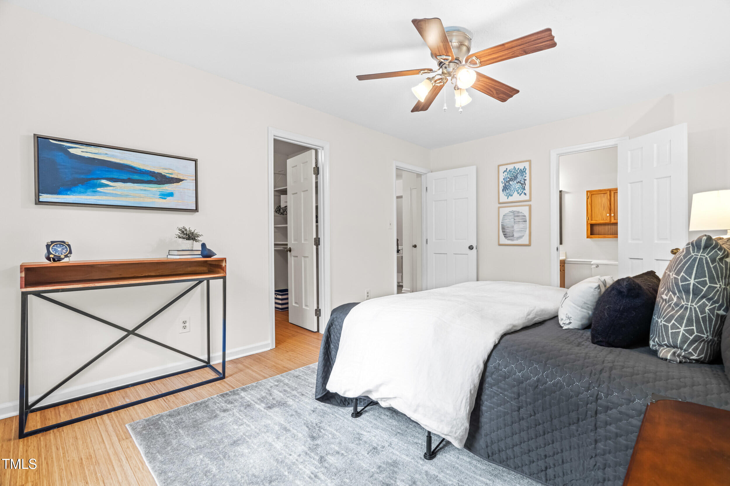 105 Firewood Circle Raleigh, NC 27607 - Photo 4 of 50 a bedroom with a bed and a painting on the wall