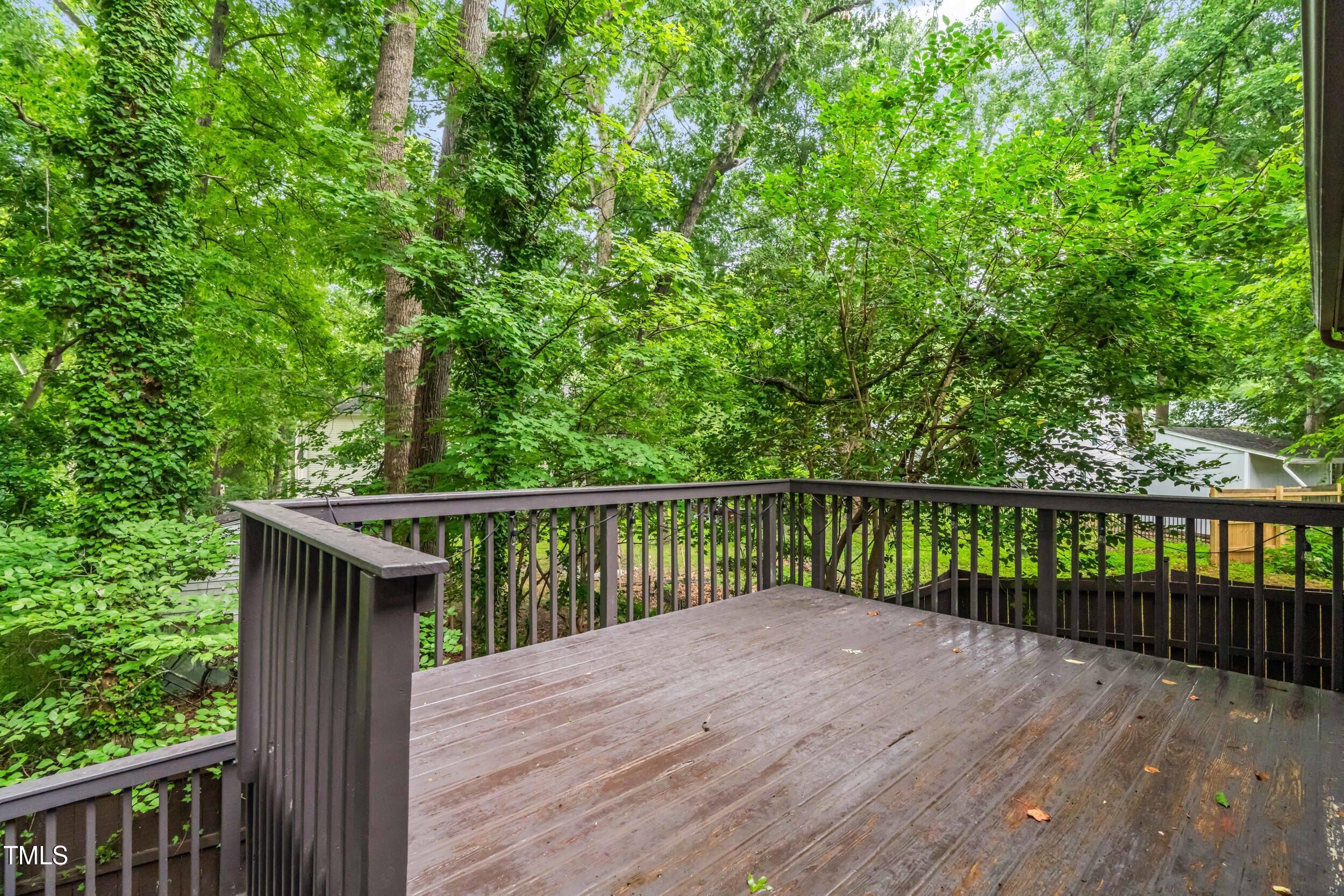 105 Firewood Circle Raleigh, NC 27607 - Photo 45 of 50 a balcony with wooden floor and fence
