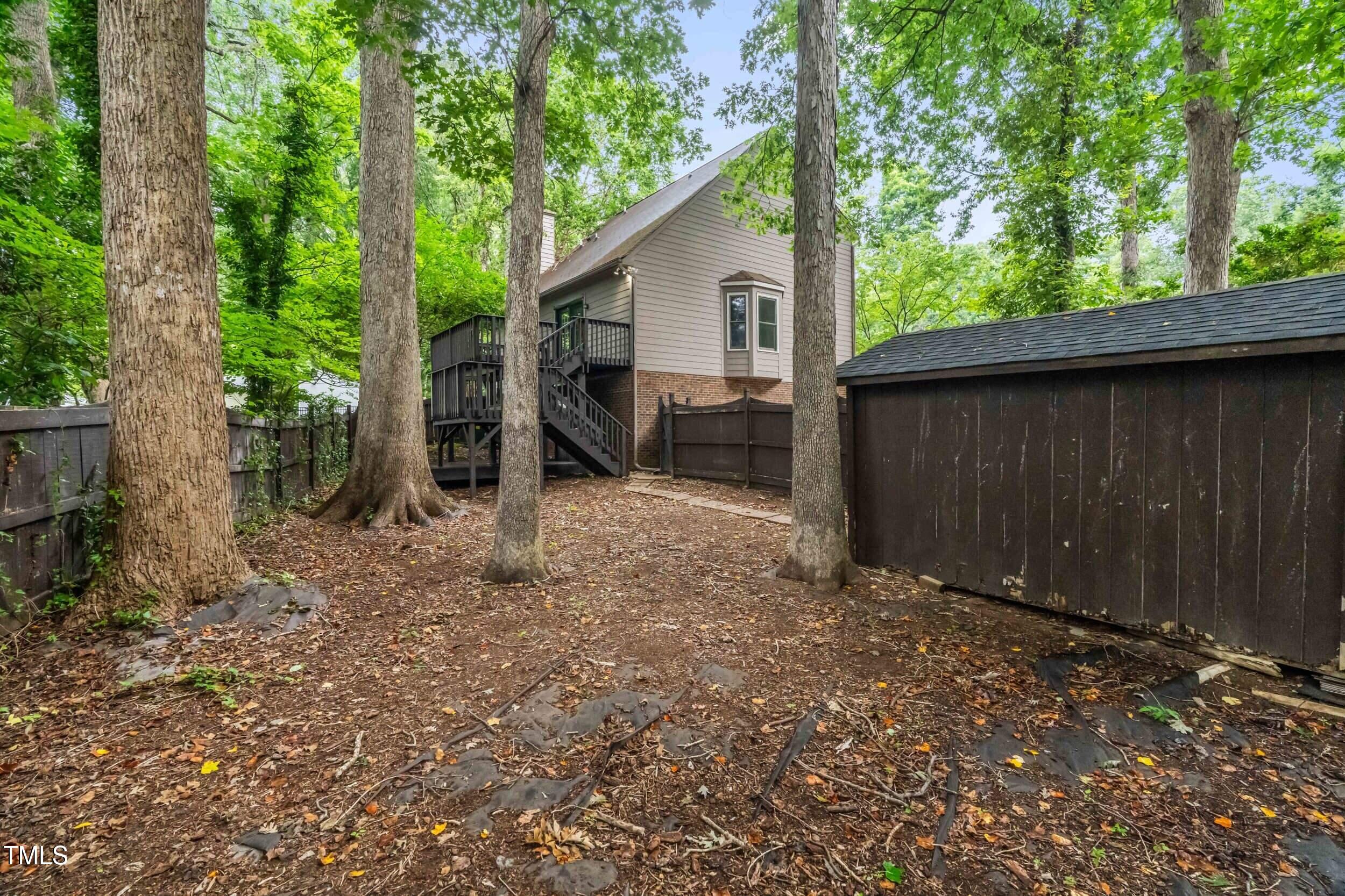 105 Firewood Circle Raleigh, NC 27607 - Photo 49 of 50 a backyard of a house with seating area
