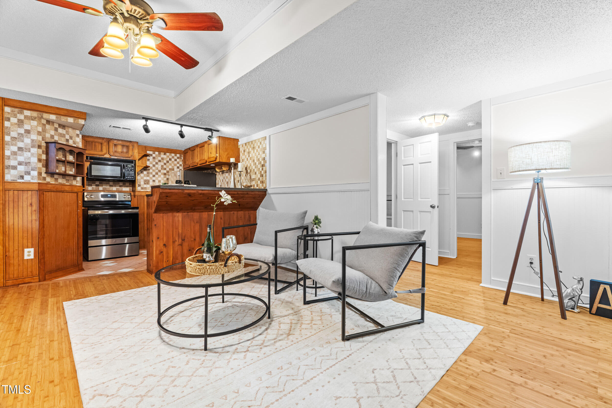 105 Firewood Circle Raleigh, NC 27607 - Photo 5 of 50 a dining room with wooden floor a table and chairs