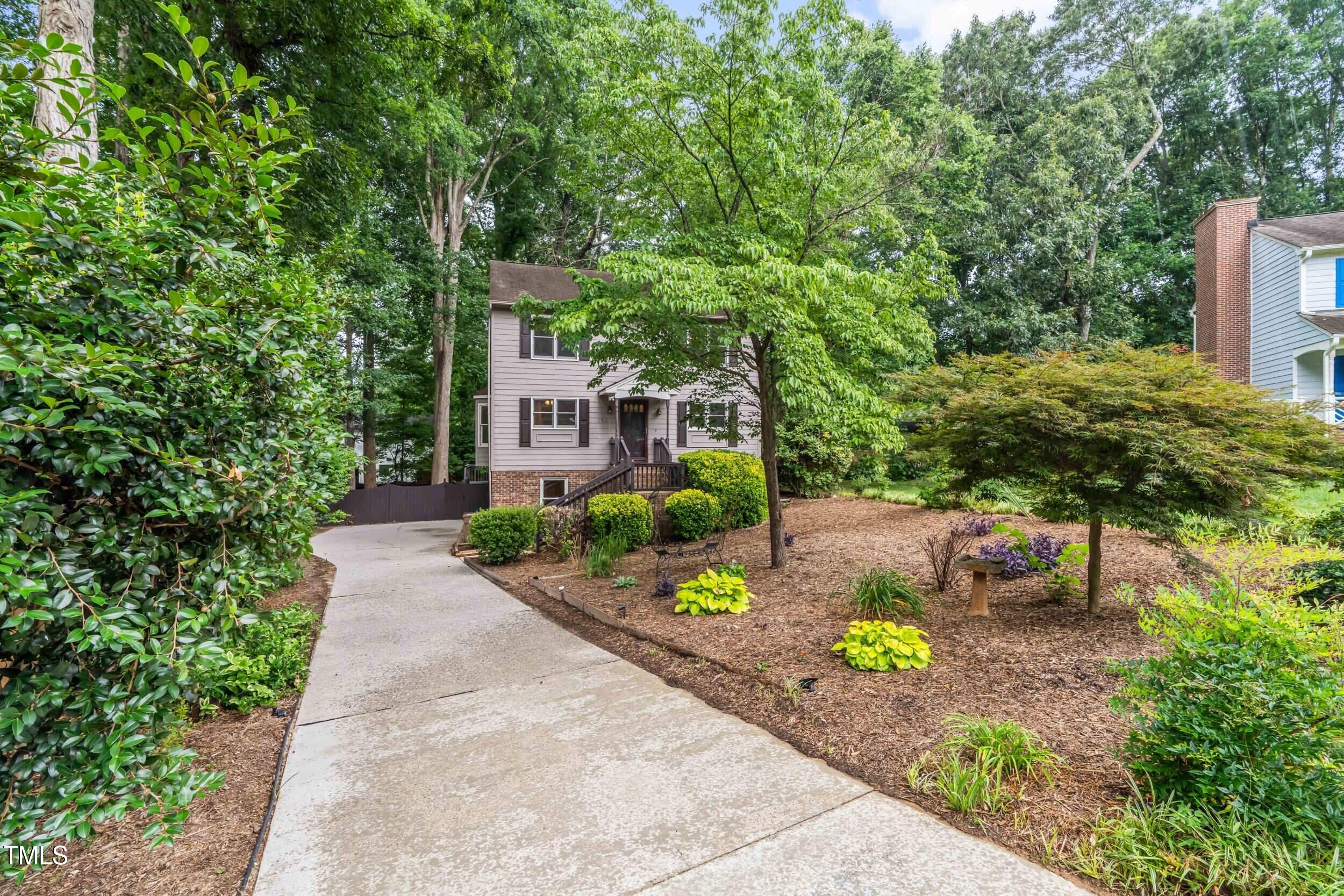 105 Firewood Circle Raleigh, NC 27607 - Photo 6 of 50 a view of a garden with potted plants