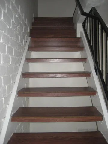 an empty room with wooden floor