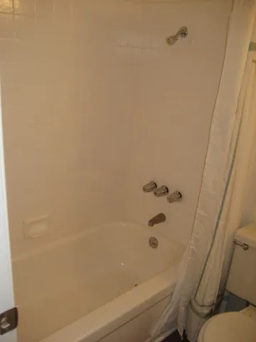 an empty room with wooden floor