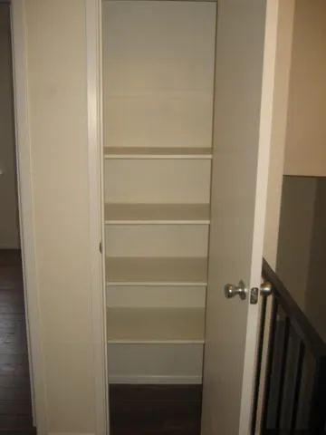 a vase of flowers sitting on a floor