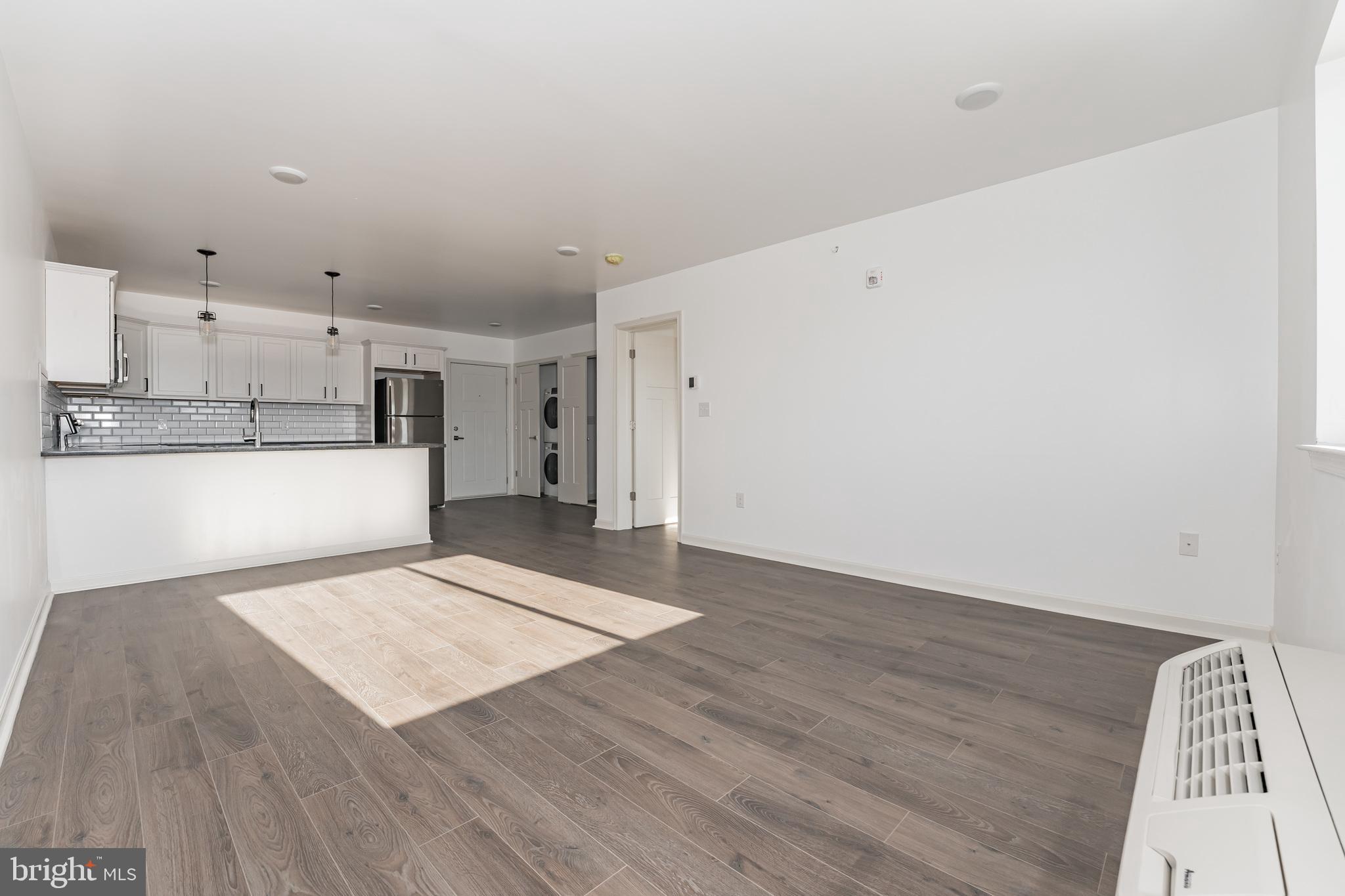 6649 Ridge Avenue, Unit A118 Philadelphia, PA 19128 - Photo 4 of 9 a view of kitchen with wooden floor