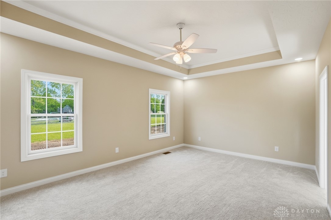 4600 Beal Road Franklin, OH 45005 - Photo 15 of 42 This spacious bedroom features a beautiful tray ceiling and soft carpeting.