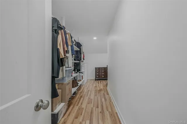 a bathroom with a double vanity sink mirror and shower