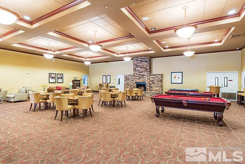 450 North Arlington Avenue, Unit 1207 Reno, NV 89503 - Photo 19 of 22 a living room with lots of furniture and a chandelier