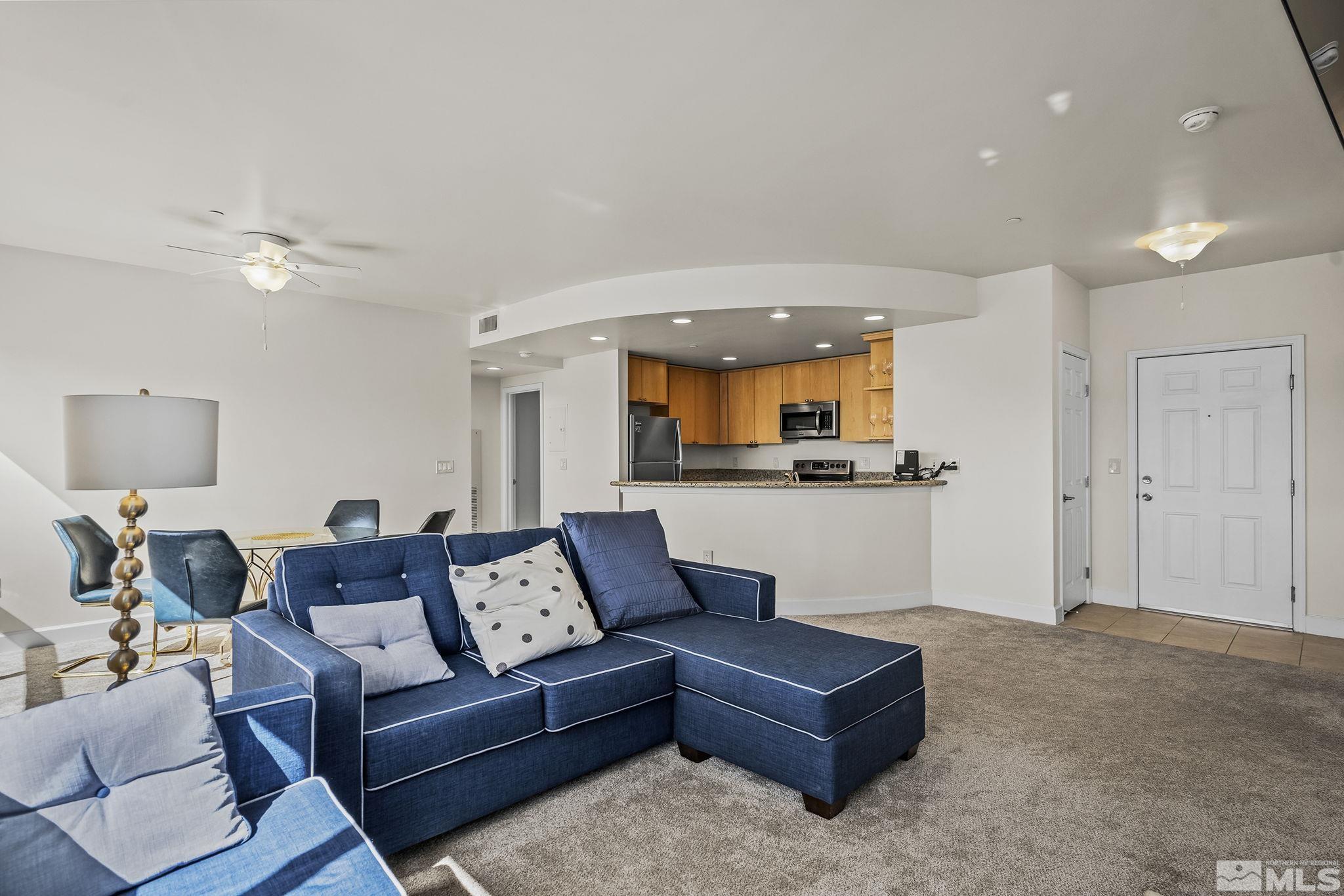 450 North Arlington Avenue, Unit 1207 Reno, NV 89503 - Photo 4 of 22 a living room with furniture and a view of kitchen