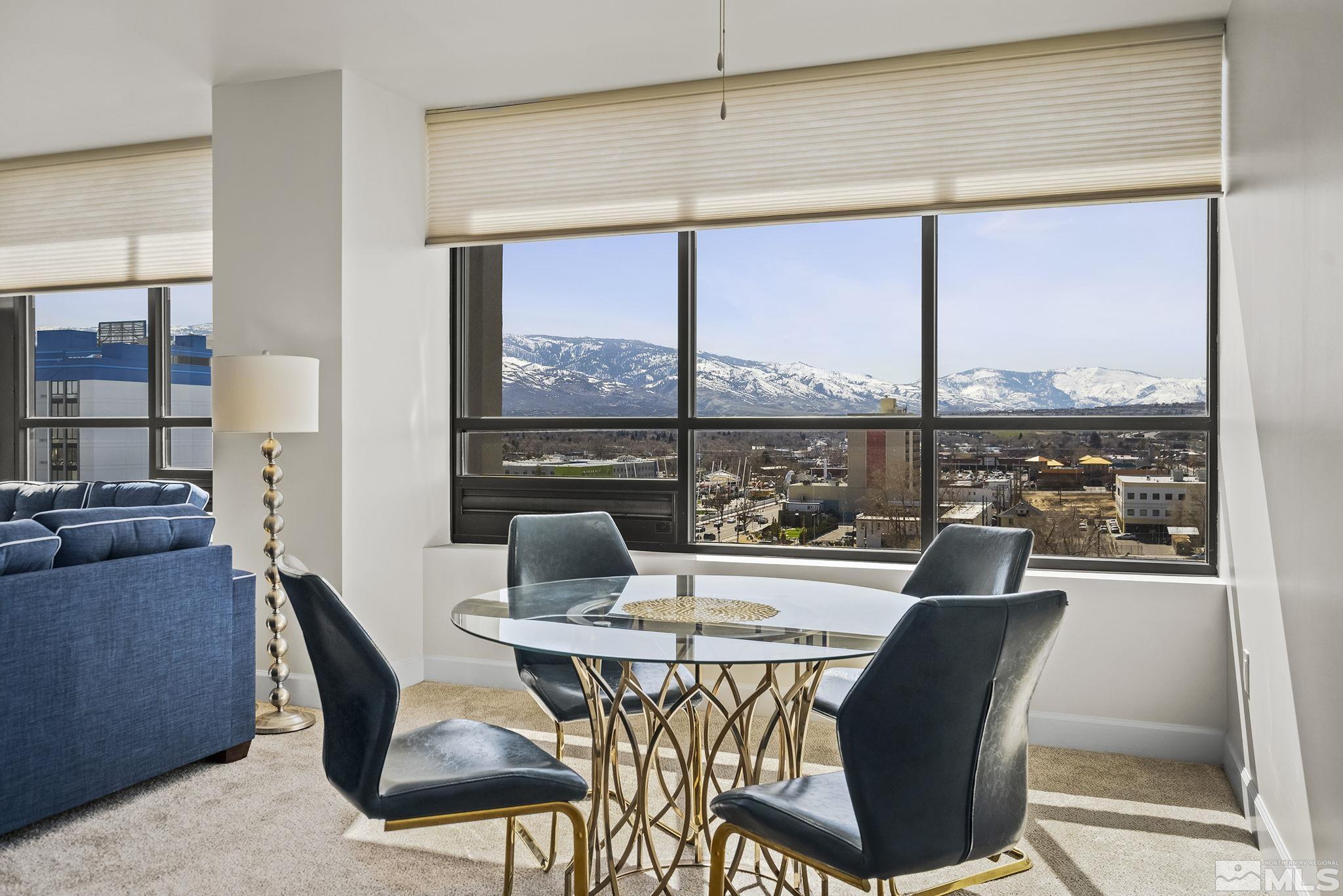 450 North Arlington Avenue, Unit 1207 Reno, NV 89503 - Photo 7 of 22 a dining room with furniture a chandelier and wooden floor