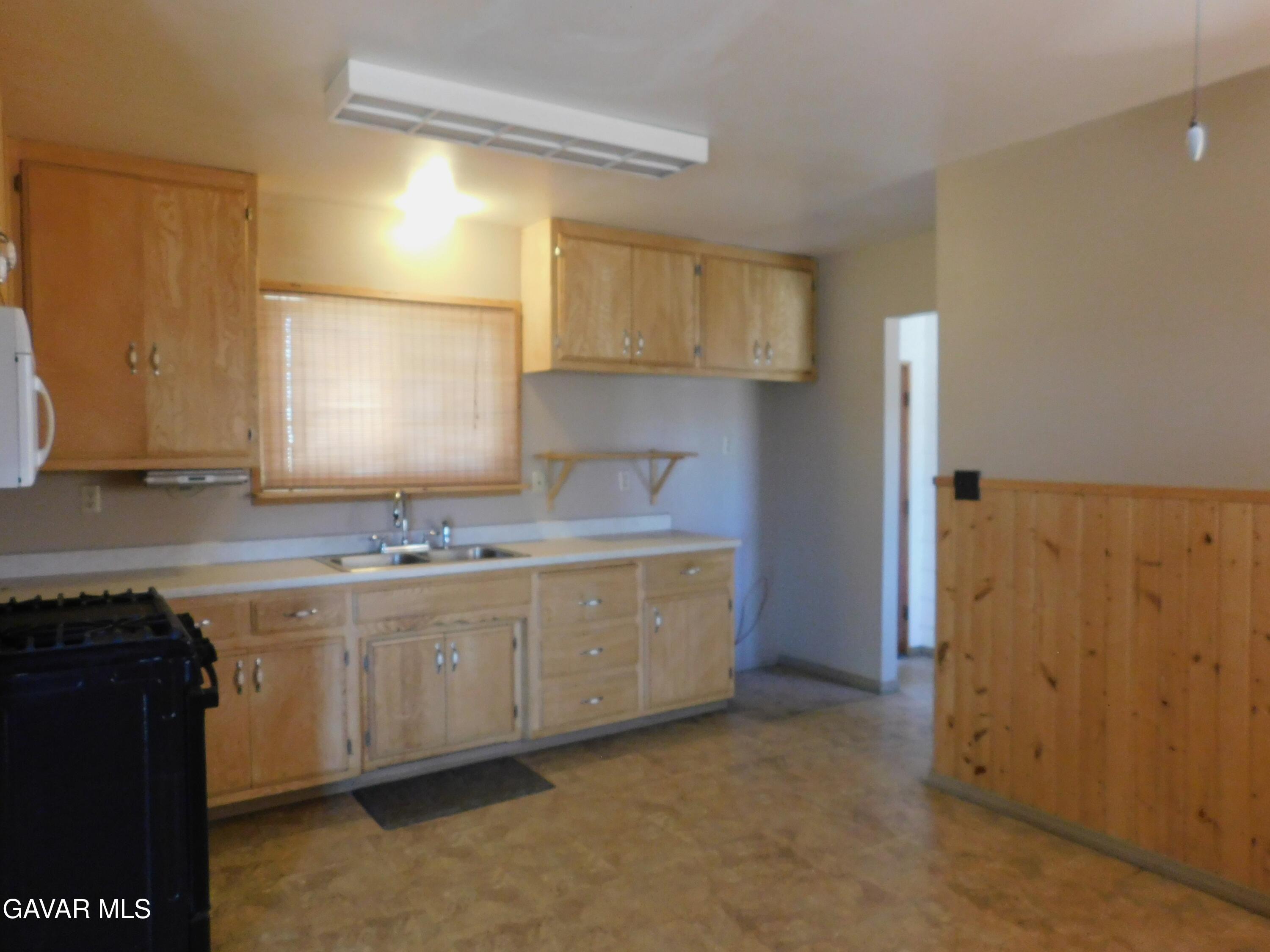 16873 Alexander Avenue Edwards, CA 93523 - Photo 4 of 31 a bathroom with a sink and a mirror