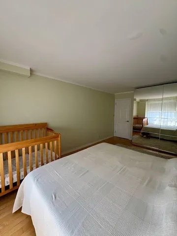 a view of a bedroom with closet