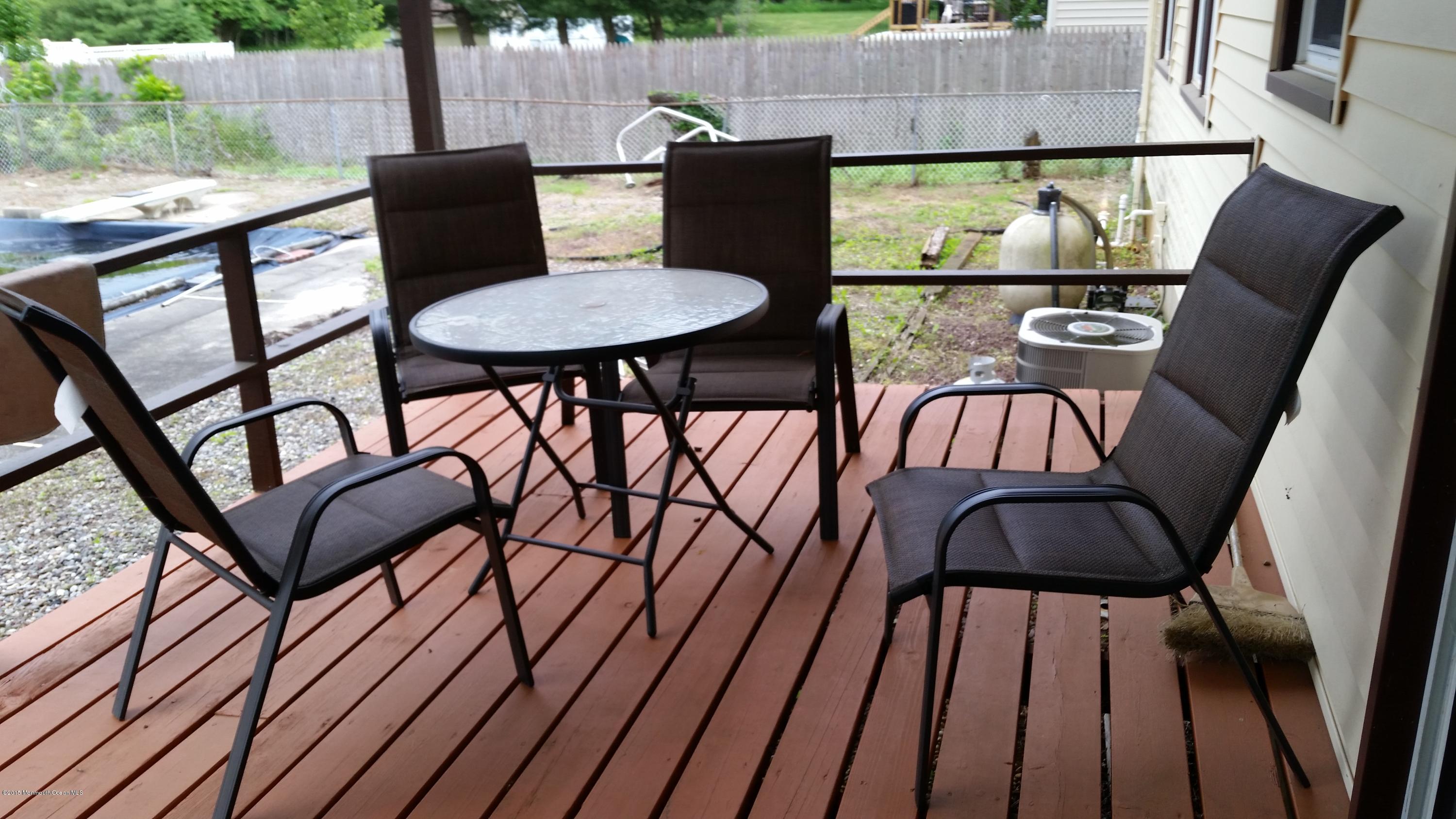 51 Hidden Stream Road Freehold, NJ 07728 - Photo 14 of 21 a view of a chairs and table in patio