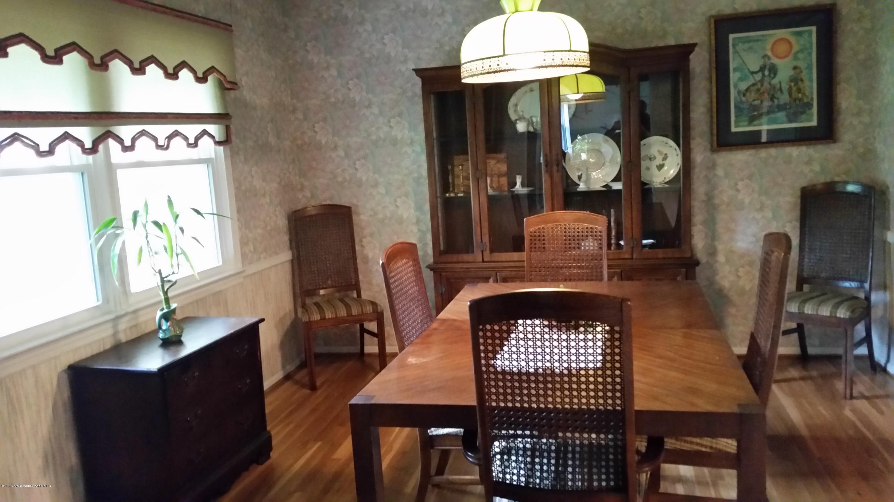 51 Hidden Stream Road Freehold, NJ 07728 - Photo 2 of 21 a view of a dining room with furniture and wooden floor