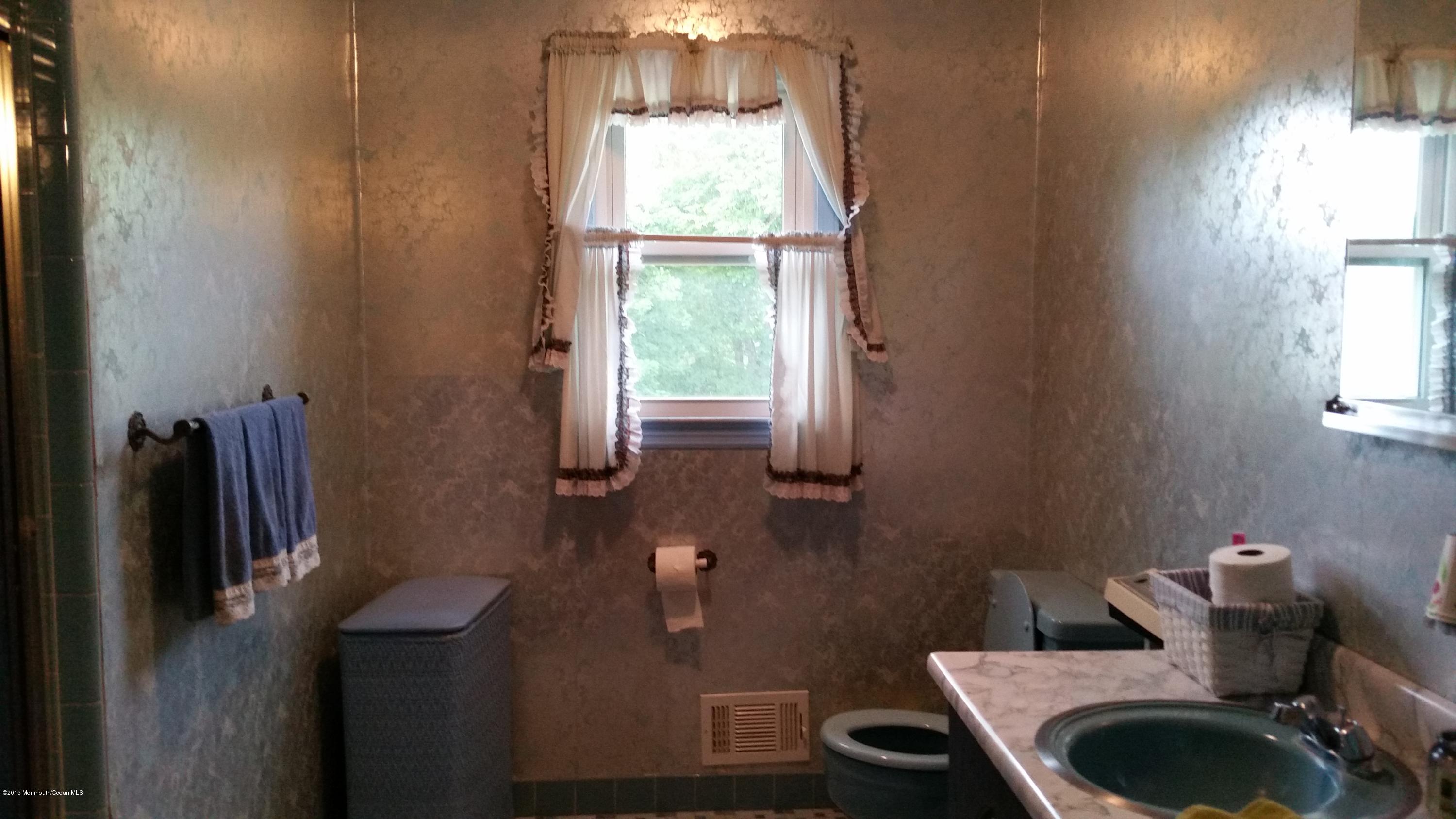 51 Hidden Stream Road Freehold, NJ 07728 - Photo 21 of 21 a bathroom with a sink and a window