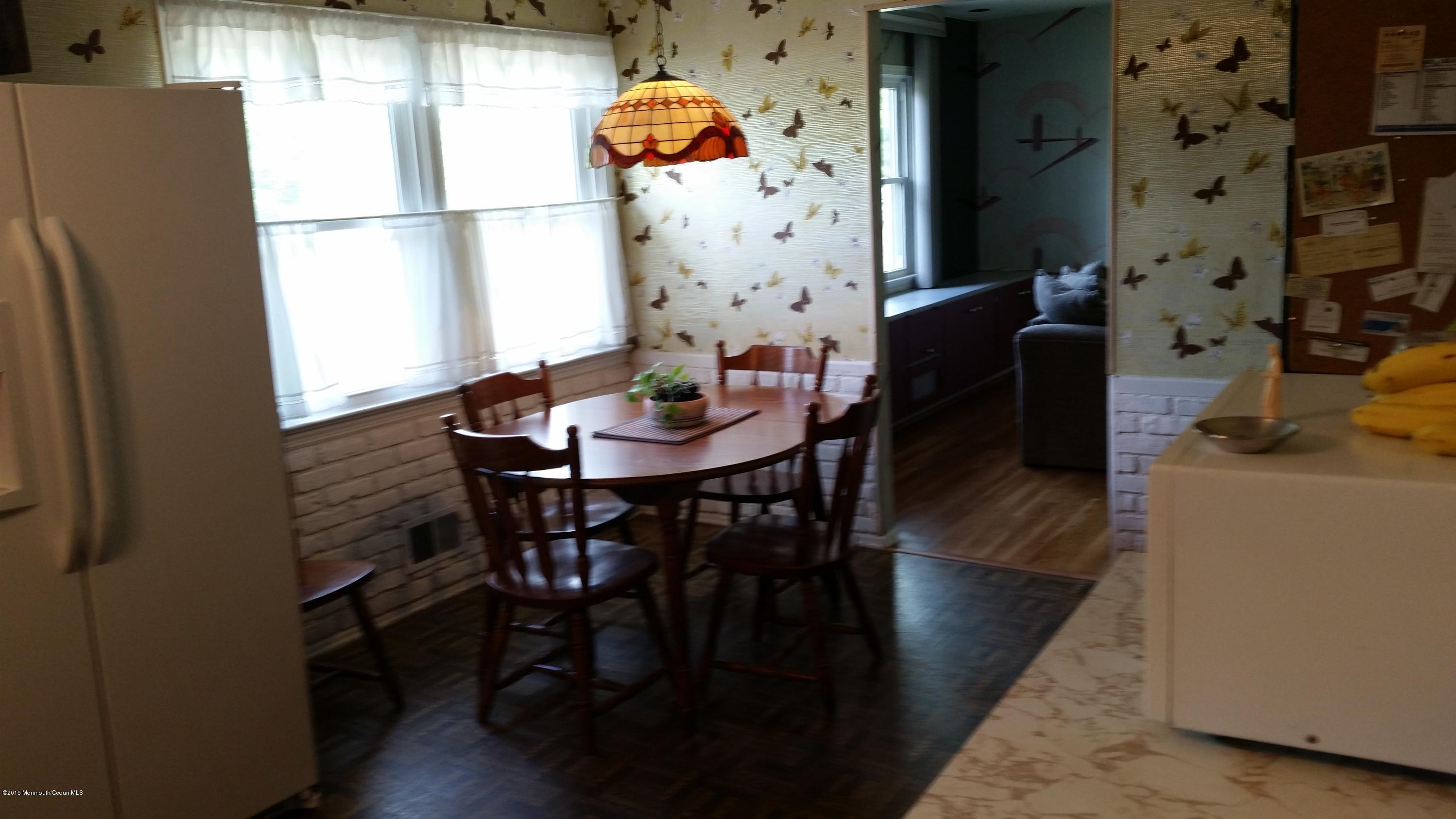51 Hidden Stream Road Freehold, NJ 07728 - Photo 3 of 21 a view of a dining room with furniture and wooden floor
