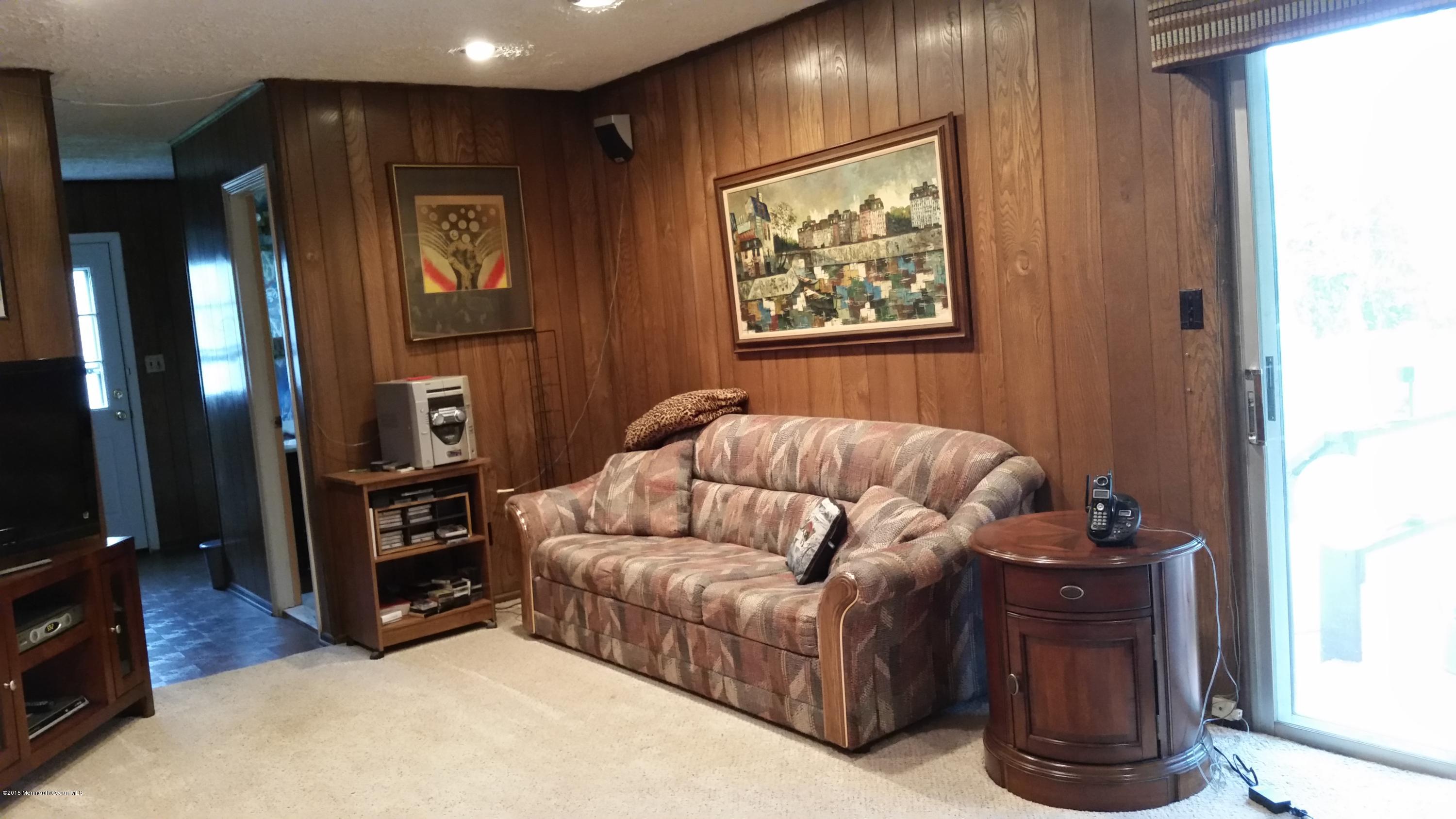 51 Hidden Stream Road Freehold, NJ 07728 - Photo 6 of 21 a living room with furniture and a flat screen tv