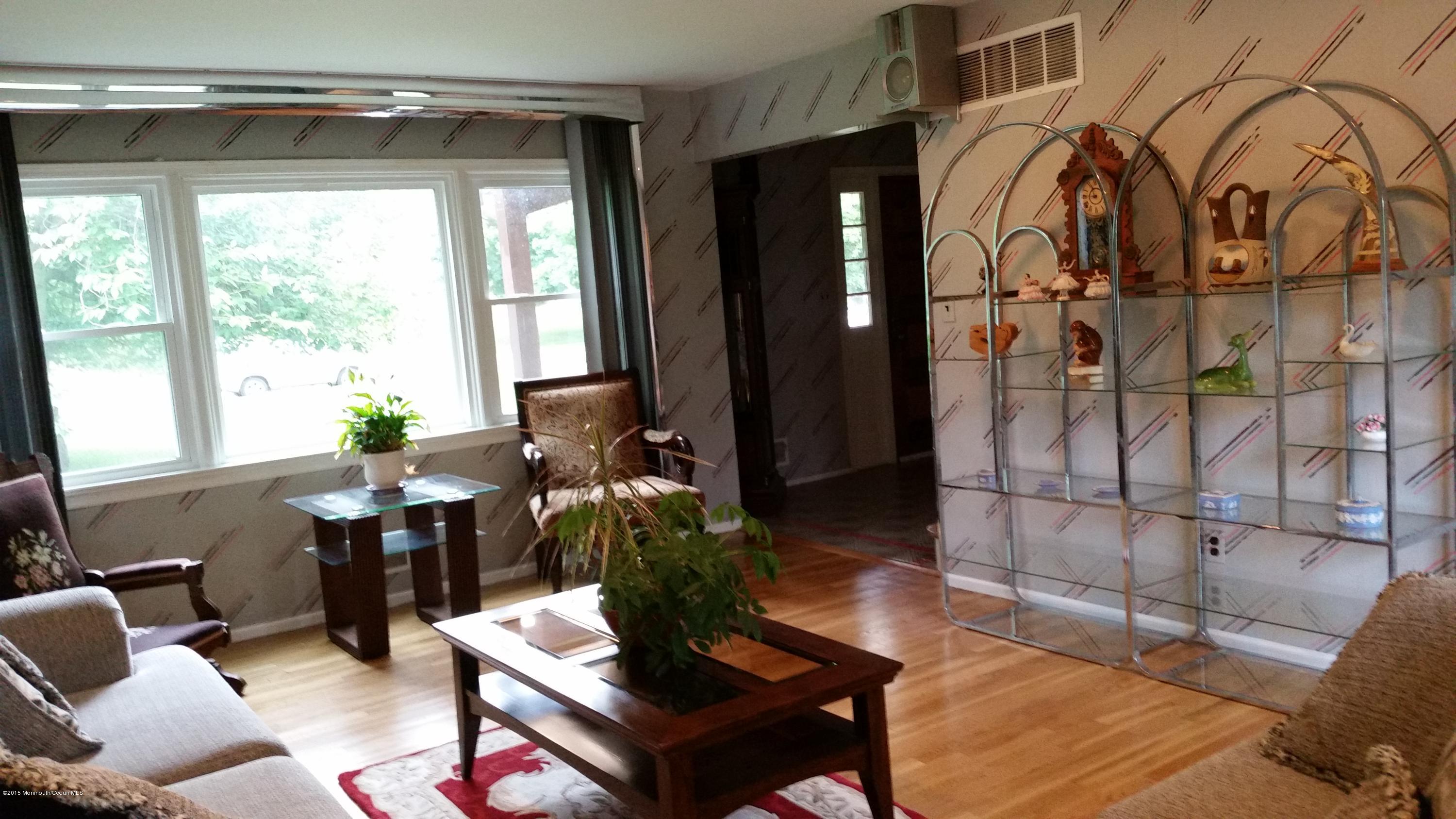 51 Hidden Stream Road Freehold, NJ 07728 - Photo 9 of 21 a living room with furniture and wooden floor