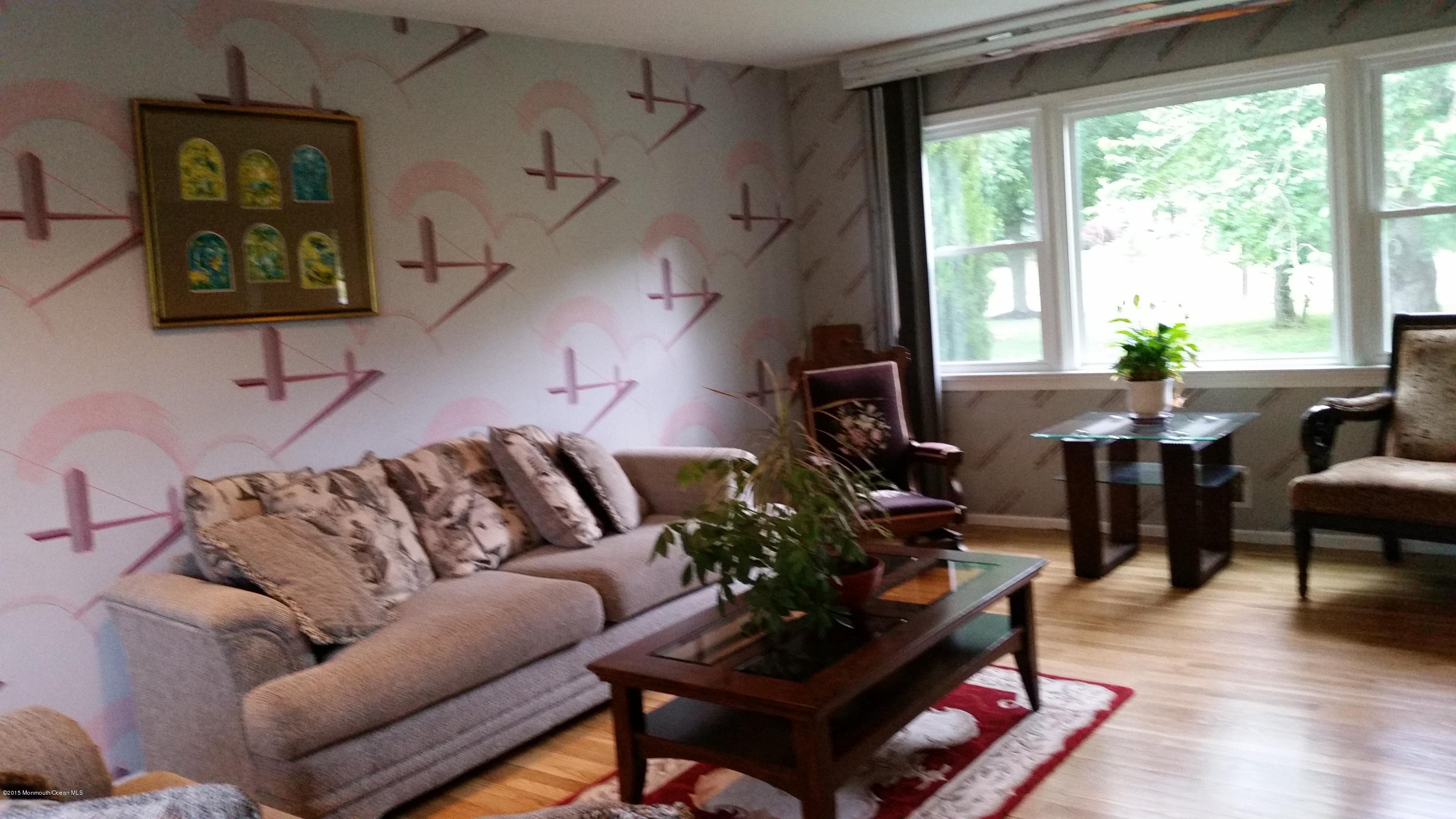 51 Hidden Stream Road Freehold, NJ 07728 - Photo 10 of 21 a living room with furniture and wooden floor