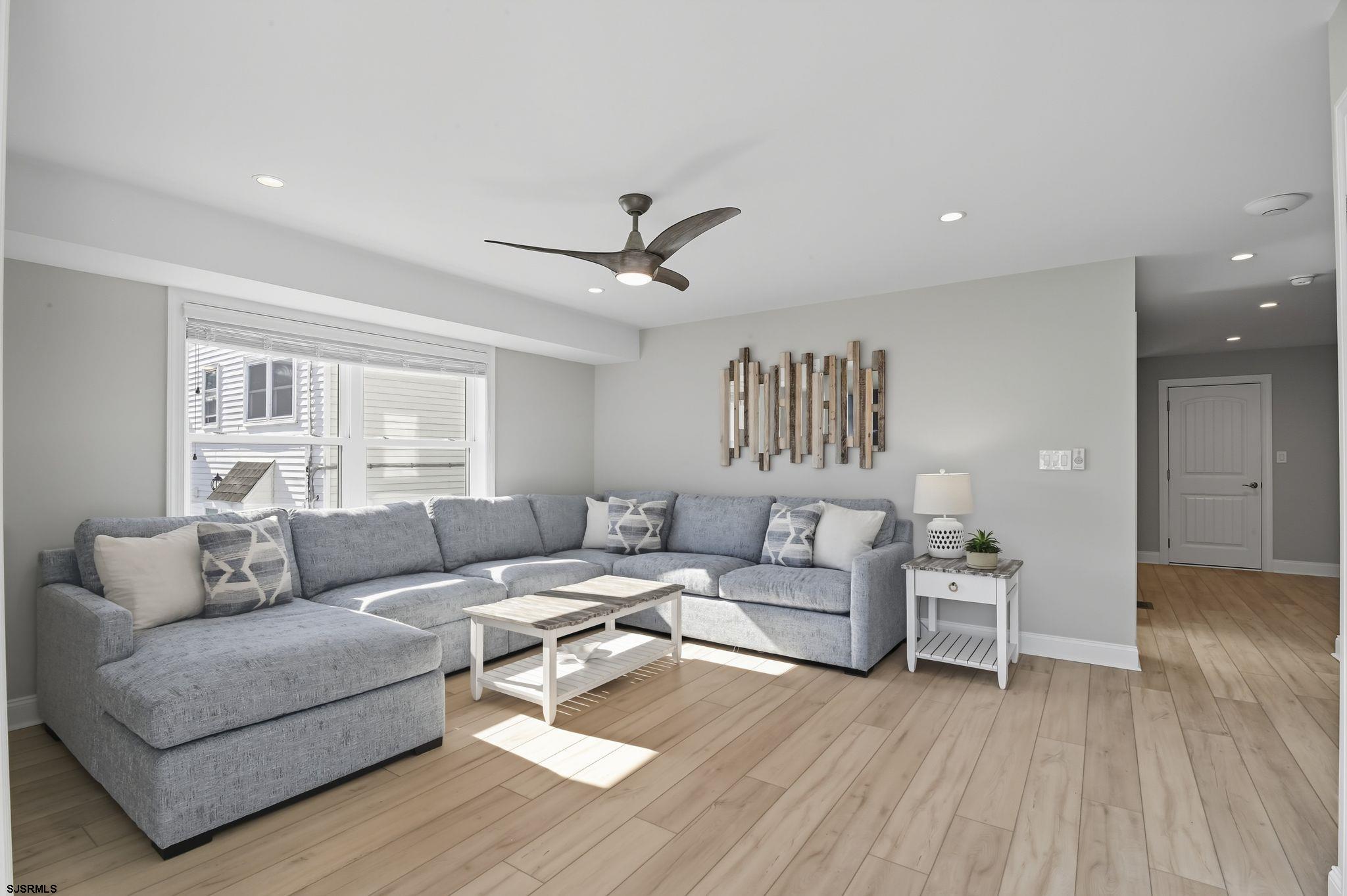 223 8th Street South Brigantine, NJ 08203 - Photo 12 of 46 a living room with furniture and a wooden floor