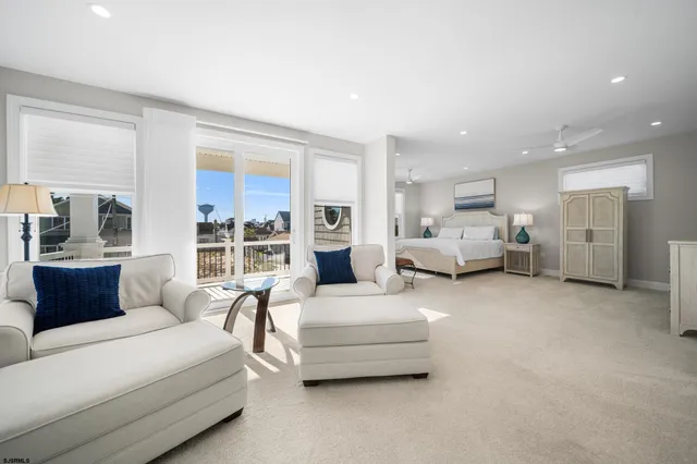 a living room with furniture and large window