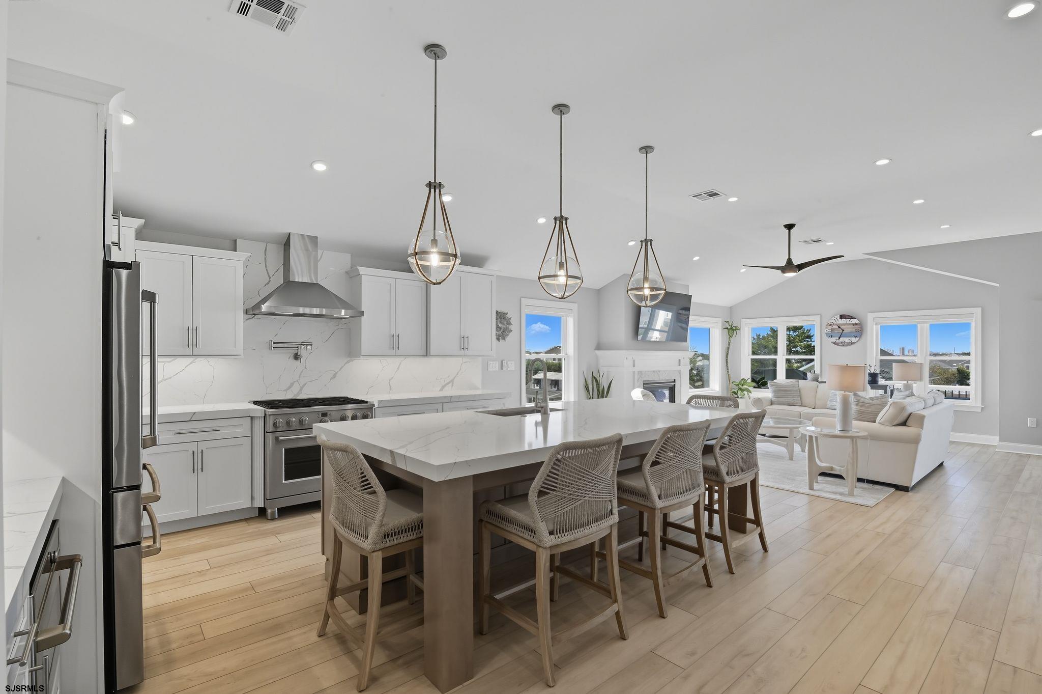 223 8th Street South Brigantine, NJ 08203 - Photo 30 of 46 a large kitchen with a table and chairs