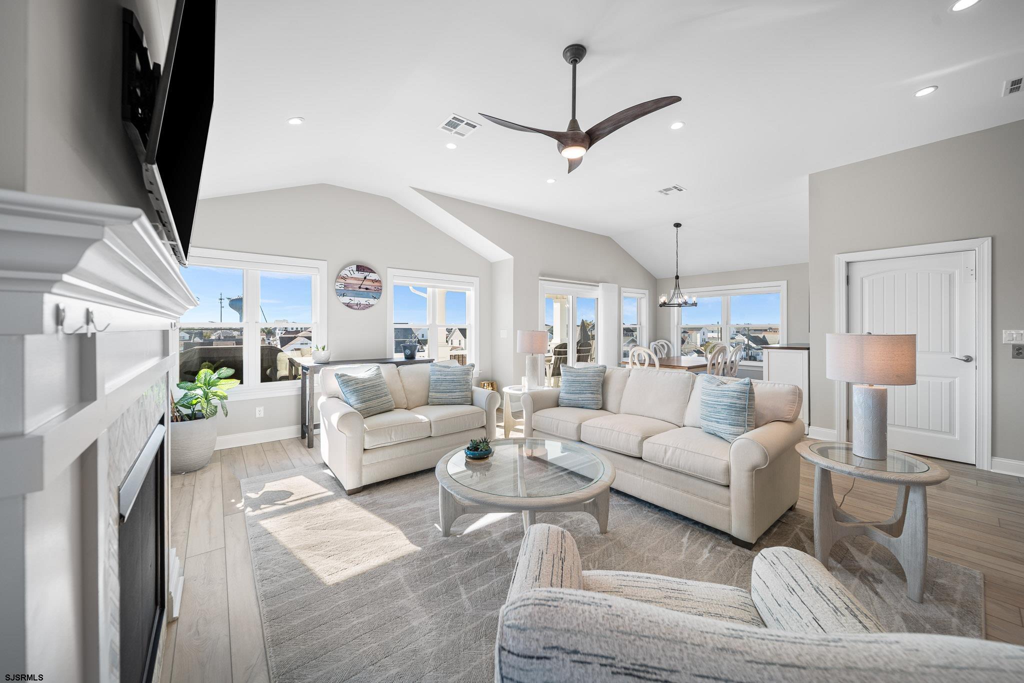 223 8th Street South Brigantine, NJ 08203 - Photo 31 of 46 a living room with furniture and a flat screen tv