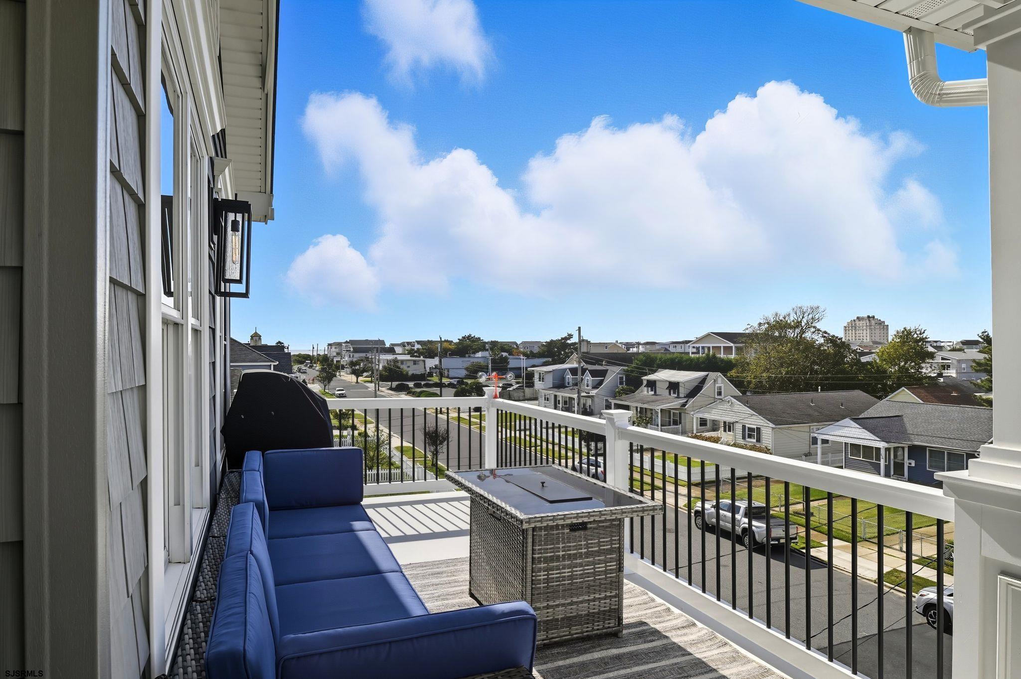 223 8th Street South Brigantine, NJ 08203 - Photo 35 of 46 a view of a balcony with two chairs and a table
