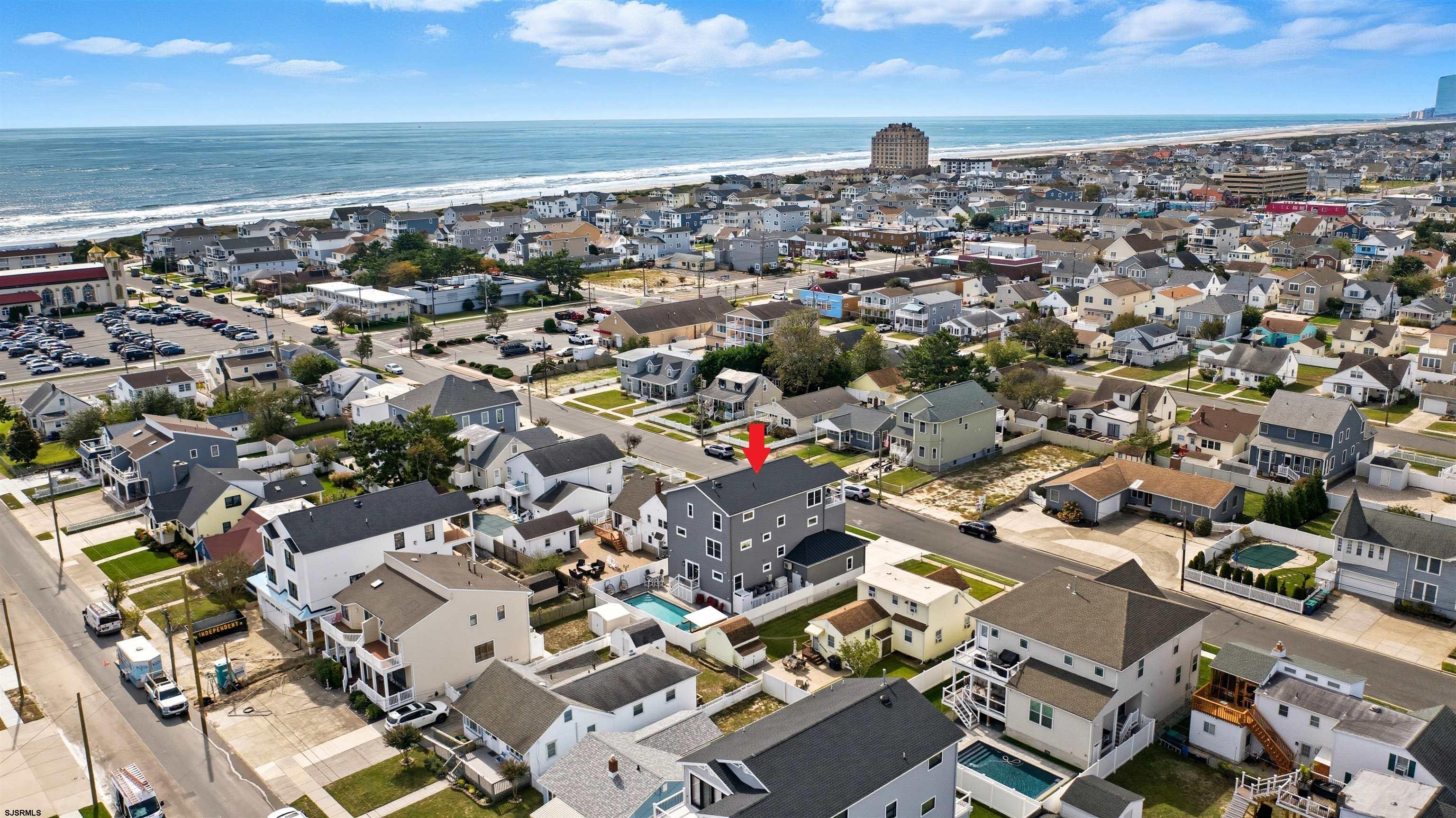 223 8th Street South Brigantine, NJ 08203 - Photo 42 of 46 an aerial view of a building with parking space