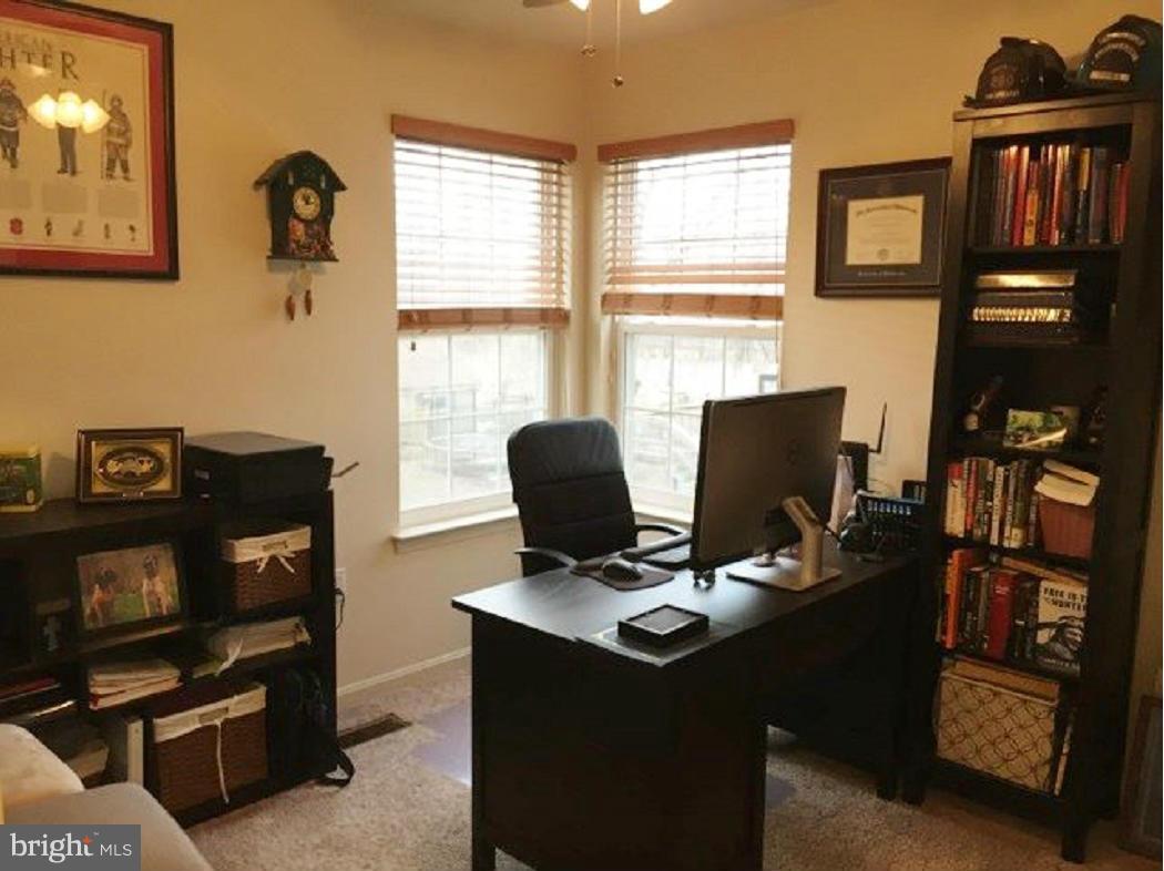 2416 Lodge Farm Road Baltimore, MD 21219 - Photo 11 of 12 a view of a workspace with furniture and a window