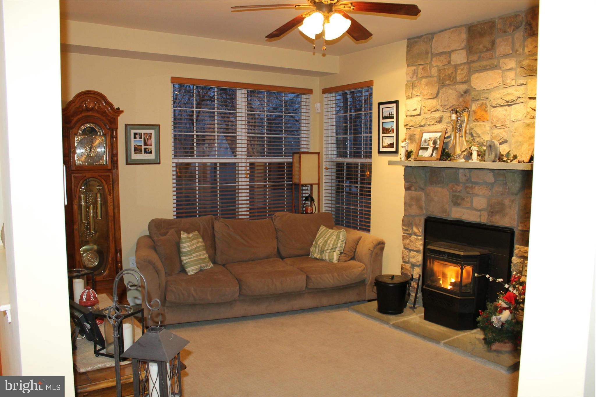 2416 Lodge Farm Road Baltimore, MD 21219 - Photo 4 of 12 a living room with furniture and a fireplace