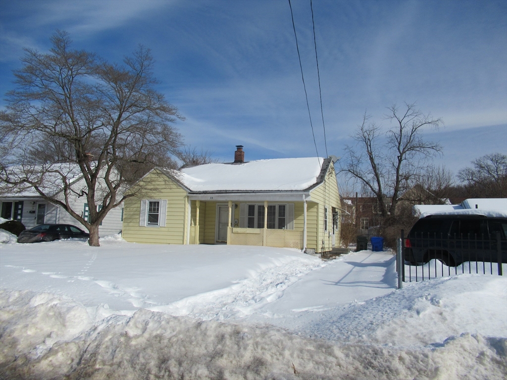 33 Connolly Street Springfield, MA 01151 - Photo 15 of 15 a front view of a house with a yard covered in snow