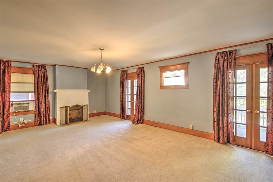 531 West William Street Decatur, IL 62522 - Photo 16 of 28 an empty room with furniture and a fireplace