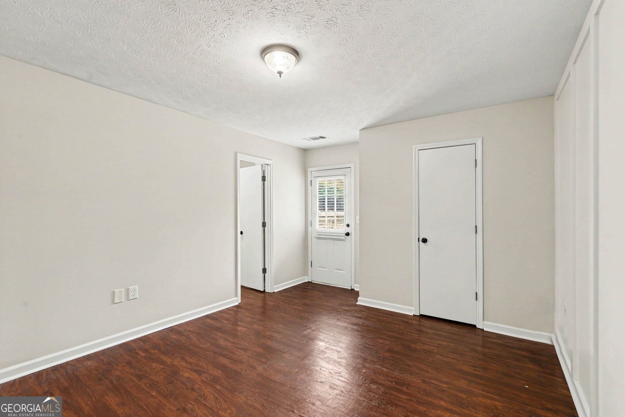 209 East Wilson Street Villa Rica, GA 30180 - Photo 19 of 24 SECOND BEDROOM WITH ACCESS TO THE BACK PATIO.
