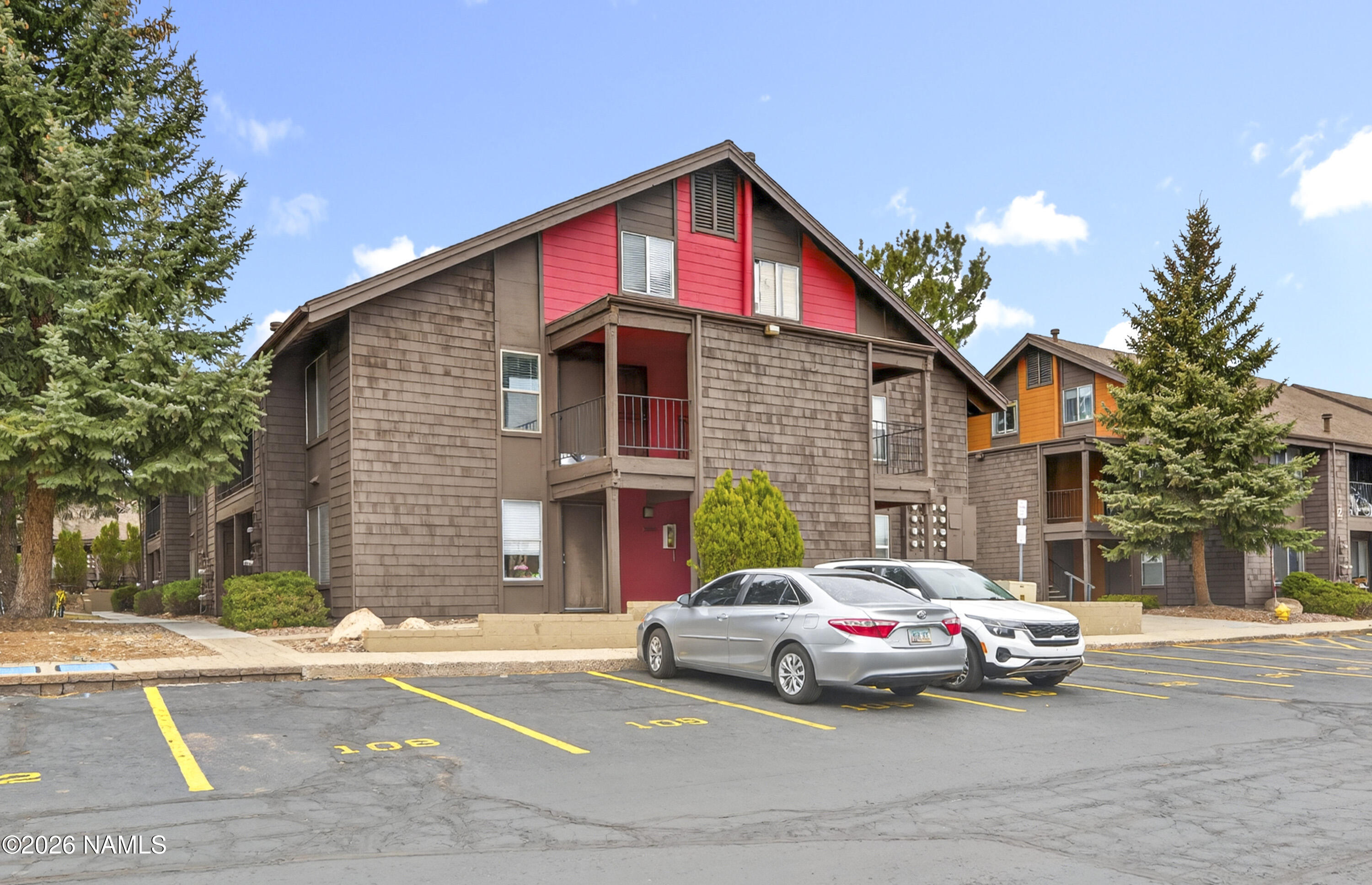 1200 South Riordan Ranch Street, Unit 112 Flagstaff, AZ 86001 - Photo 1 of 22 a car parked in front of a house